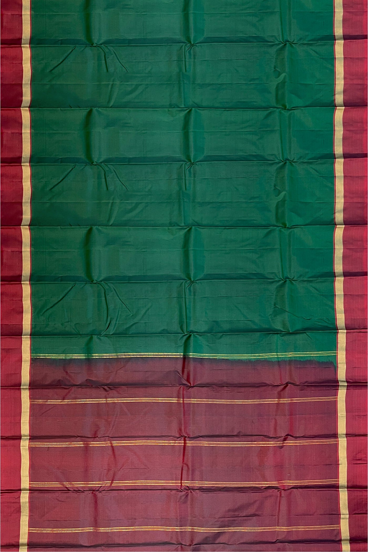 Bottle Green Light Weight Silk Saree With Plain Pattern