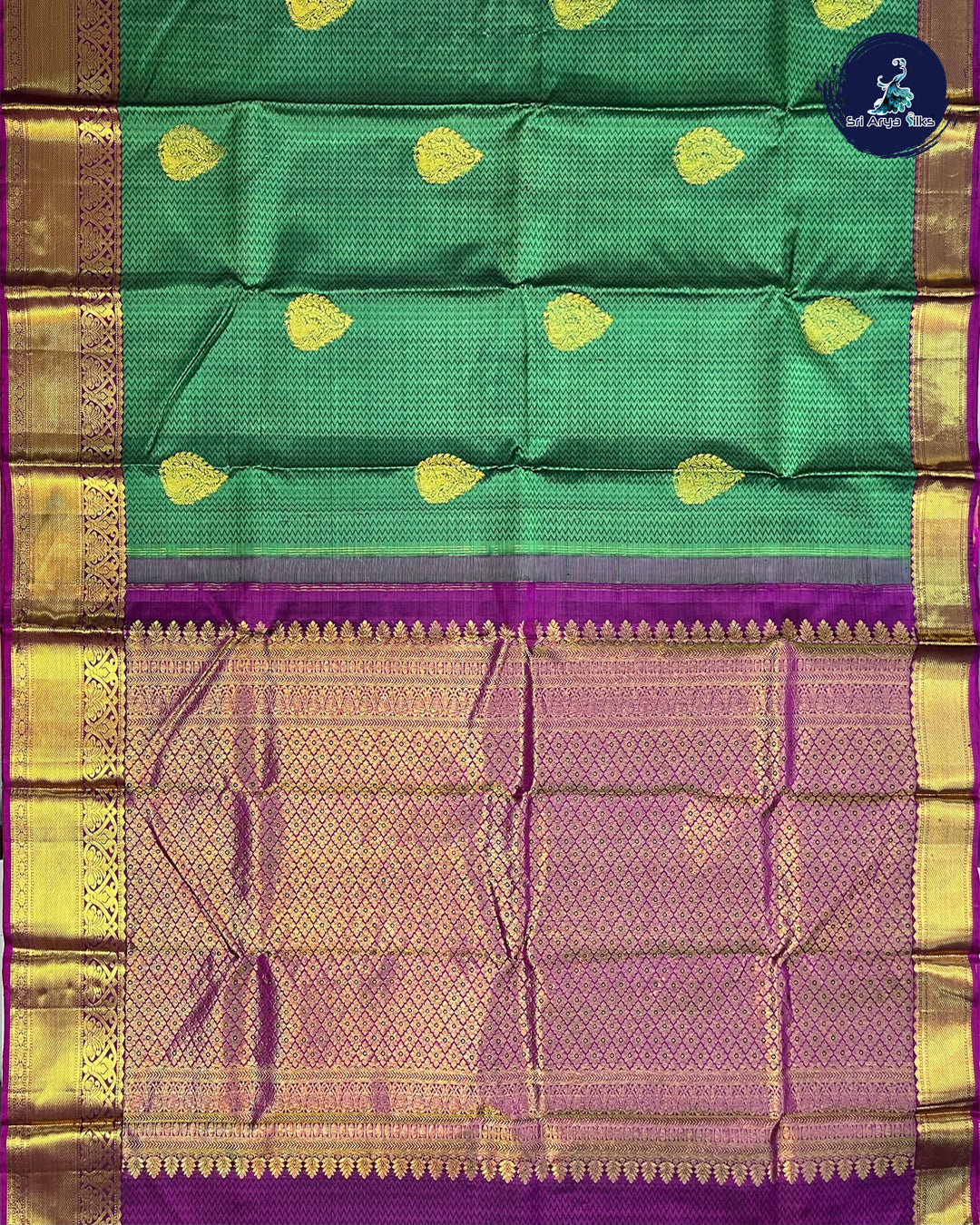 Green Traditional Silk Saree With Purple Blouse & Buttas Pattern