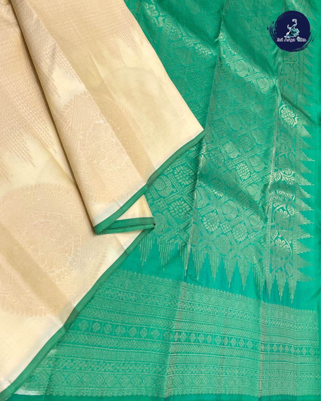White And Green Brocade Silk Saree With Green Blouse & Buttas Pattern