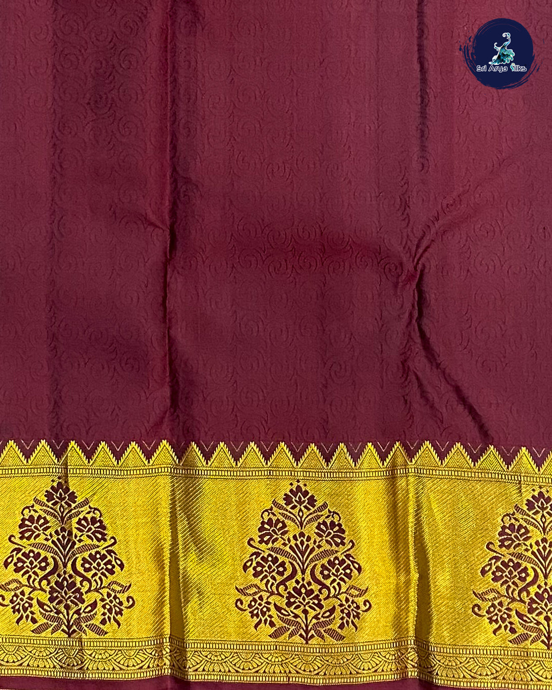Bottle Green Embosed Saree With Maroon Blouse & Buttas Pattern