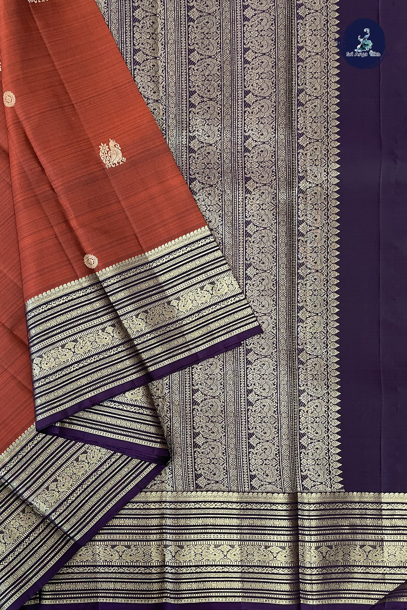 Rust Traditional Silk Saree With Zari Buttas Pattern