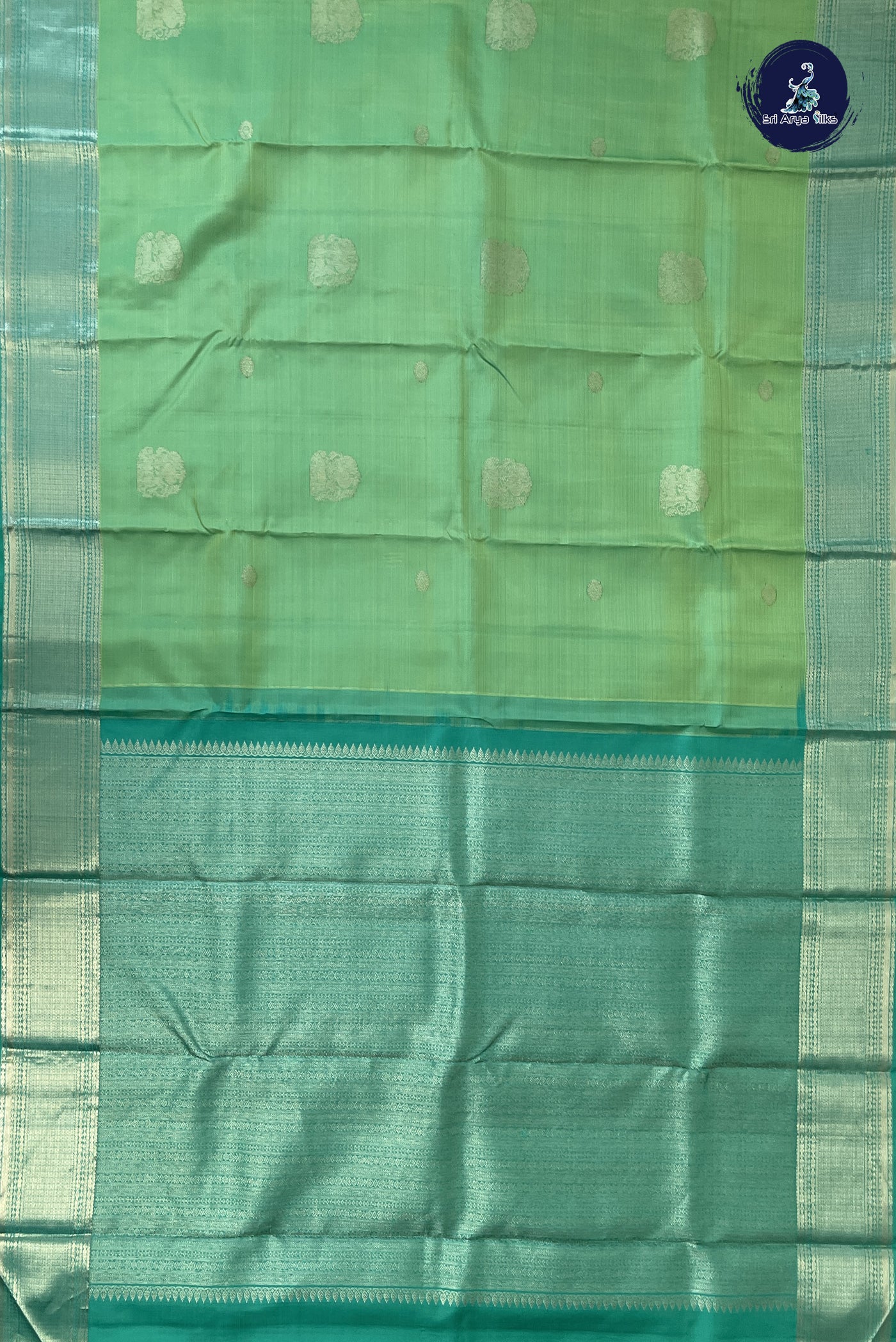 Pastel Green Traditional Silk Saree With Zari Buttas Pattern