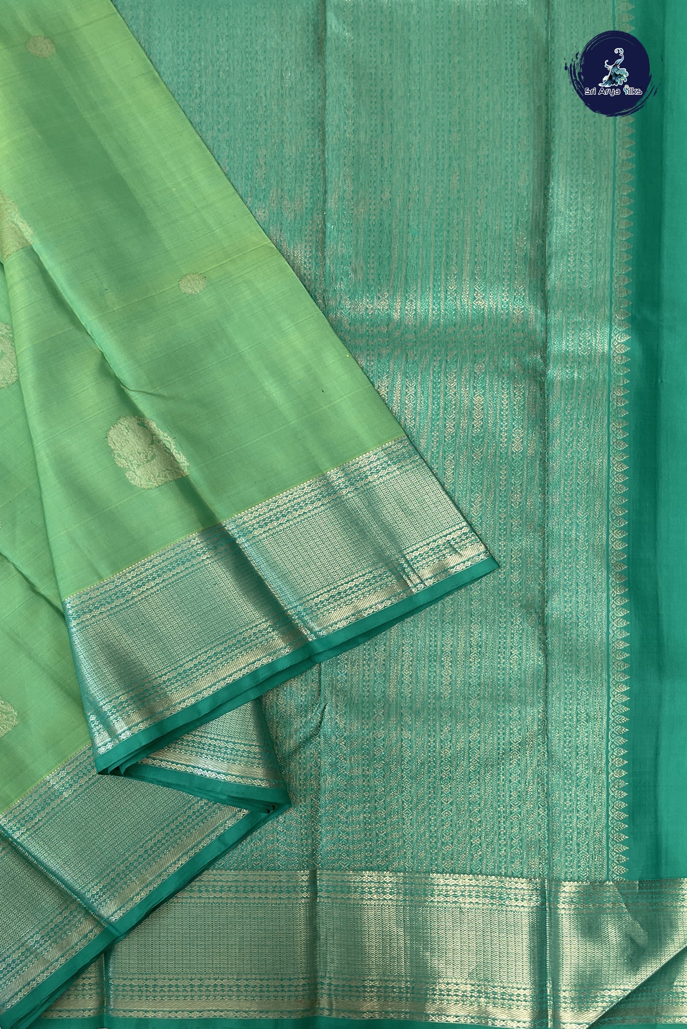 Pastel Green Traditional Silk Saree With Zari Buttas Pattern