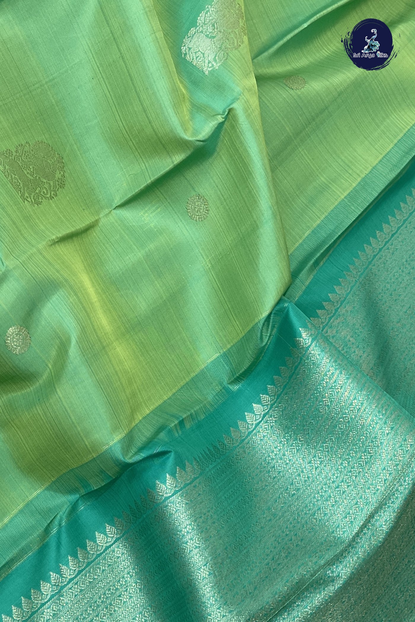 Pastel Green Traditional Silk Saree With Zari Buttas Pattern