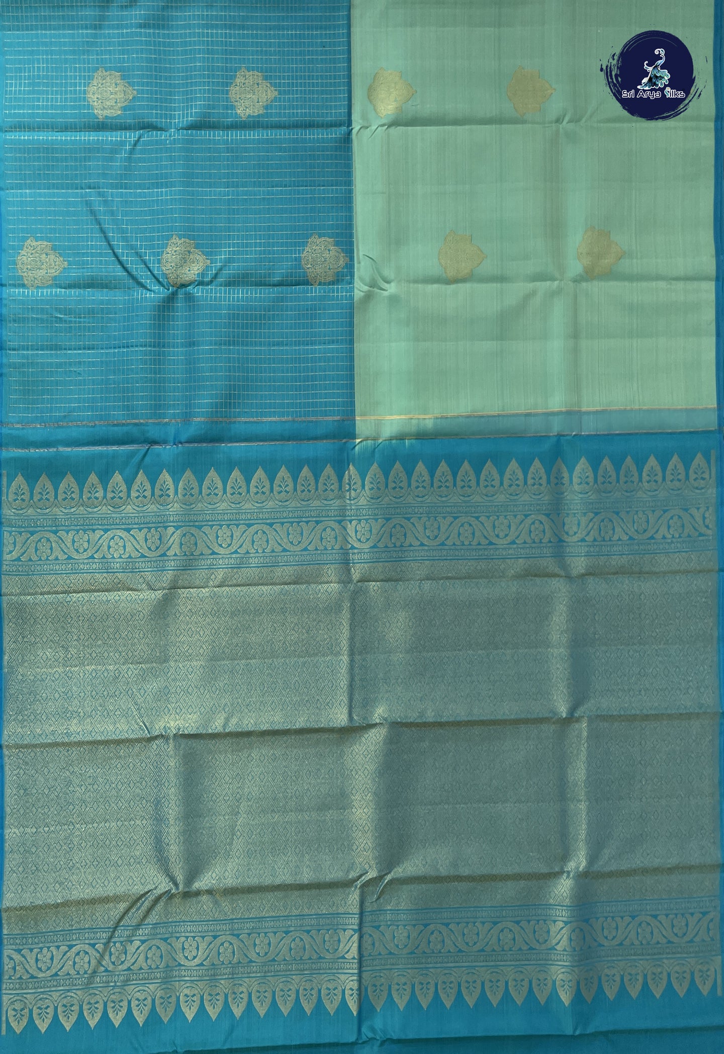 Pastel Green Half and Half Checked Silk Saree With Zari Buttas Pattern