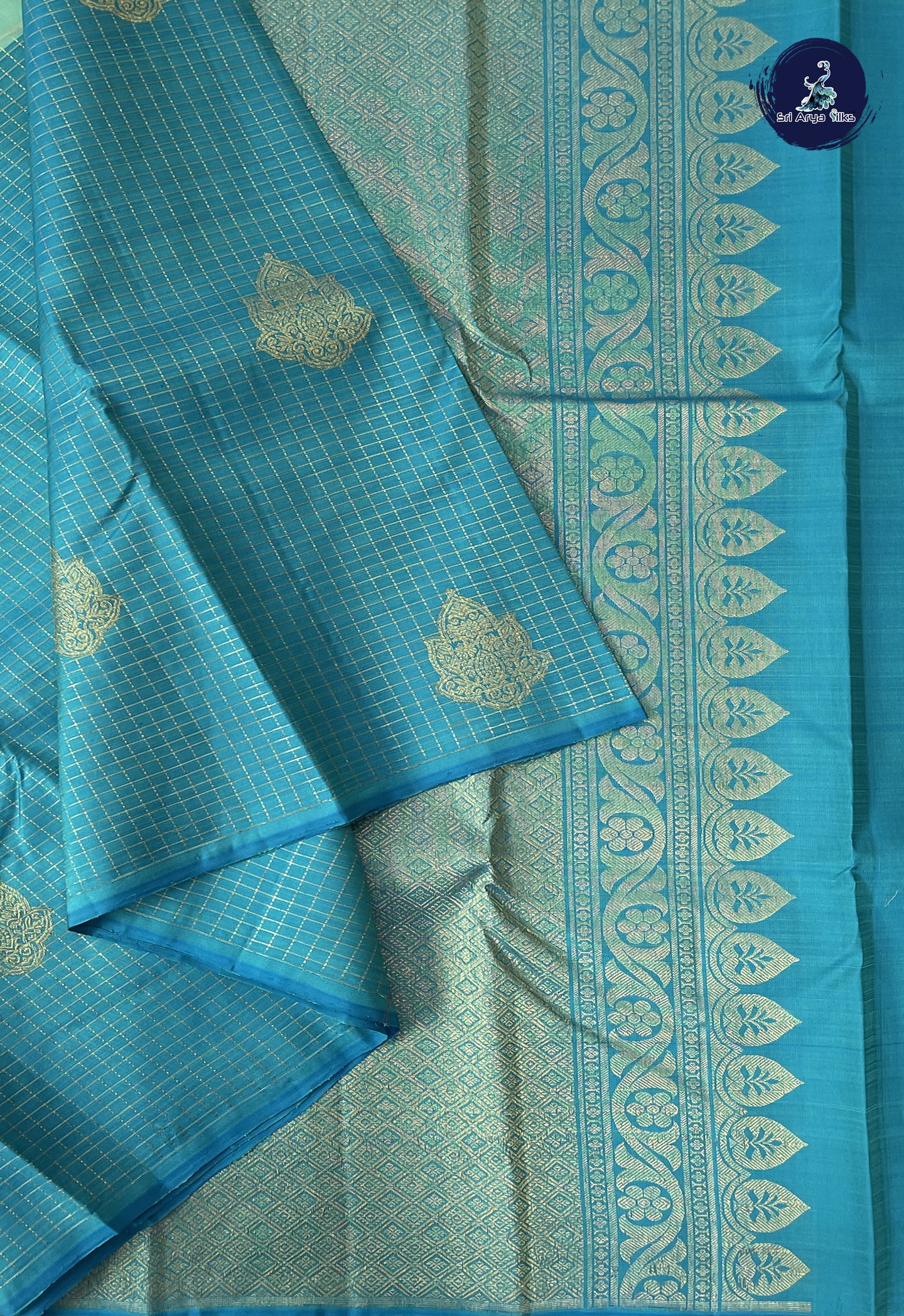 Pastel Green Half and Half Checked Silk Saree With Zari Buttas Pattern