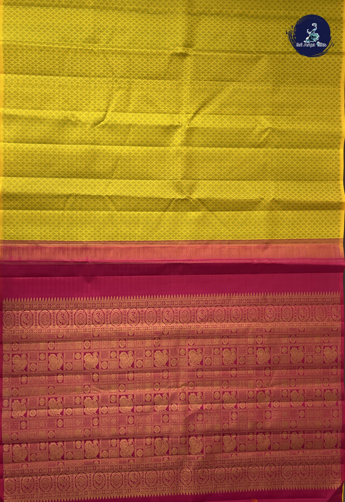 Yellow Brocade Silk Saree With Embossed Pattern