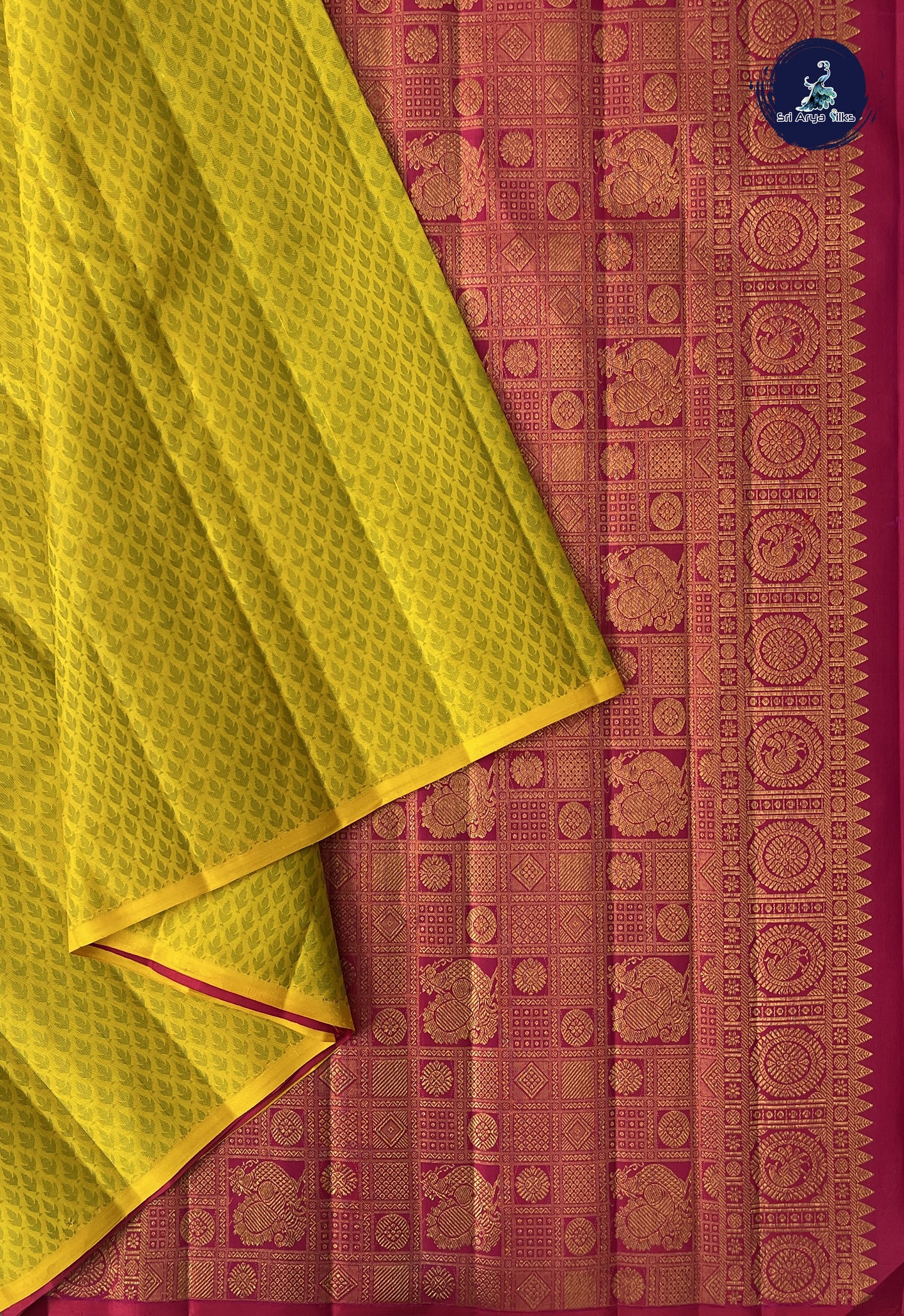 Yellow Brocade Silk Saree With Embossed Pattern