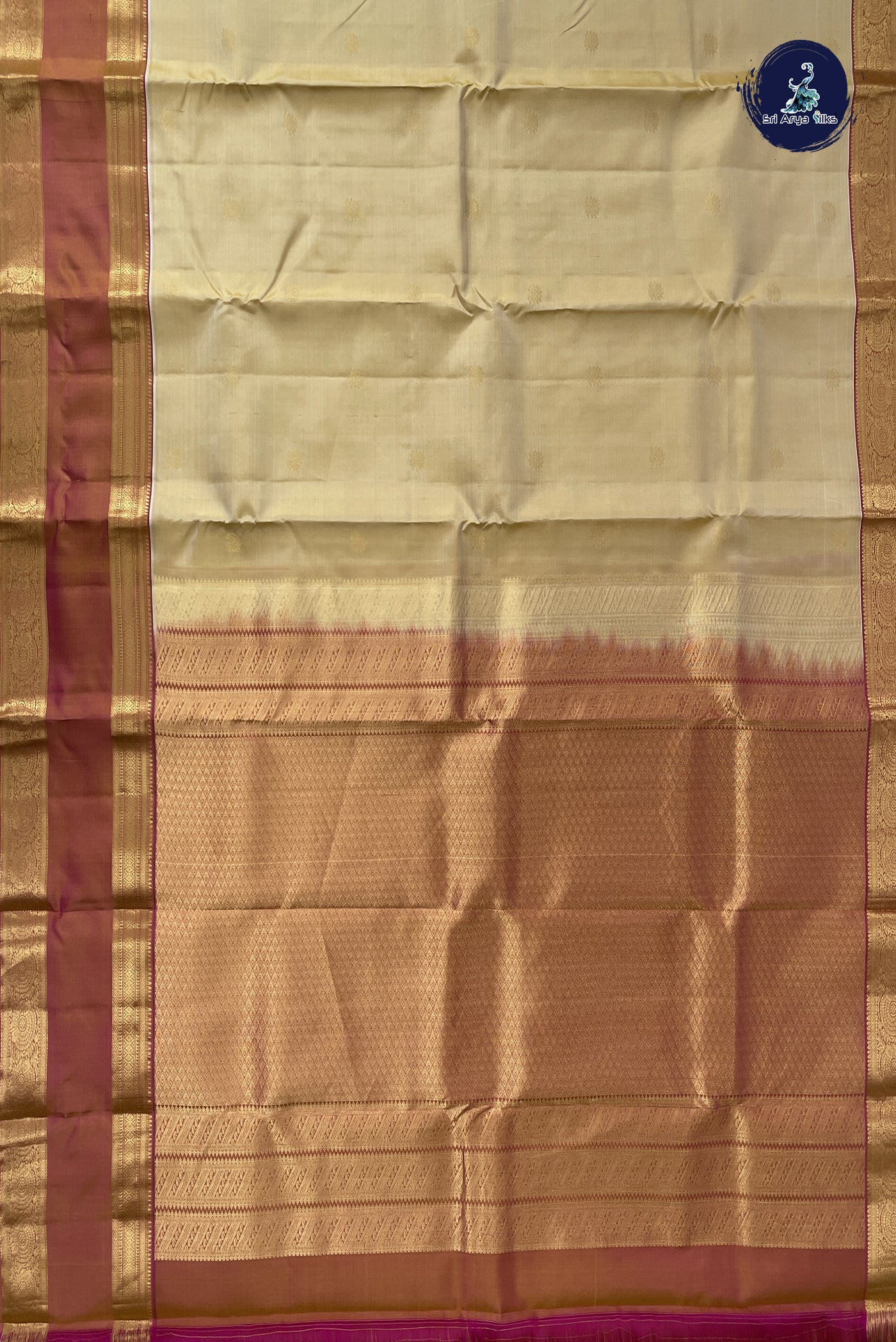 Creamish Yellow Traditional Silk Saree With Zari Buttas Pattern