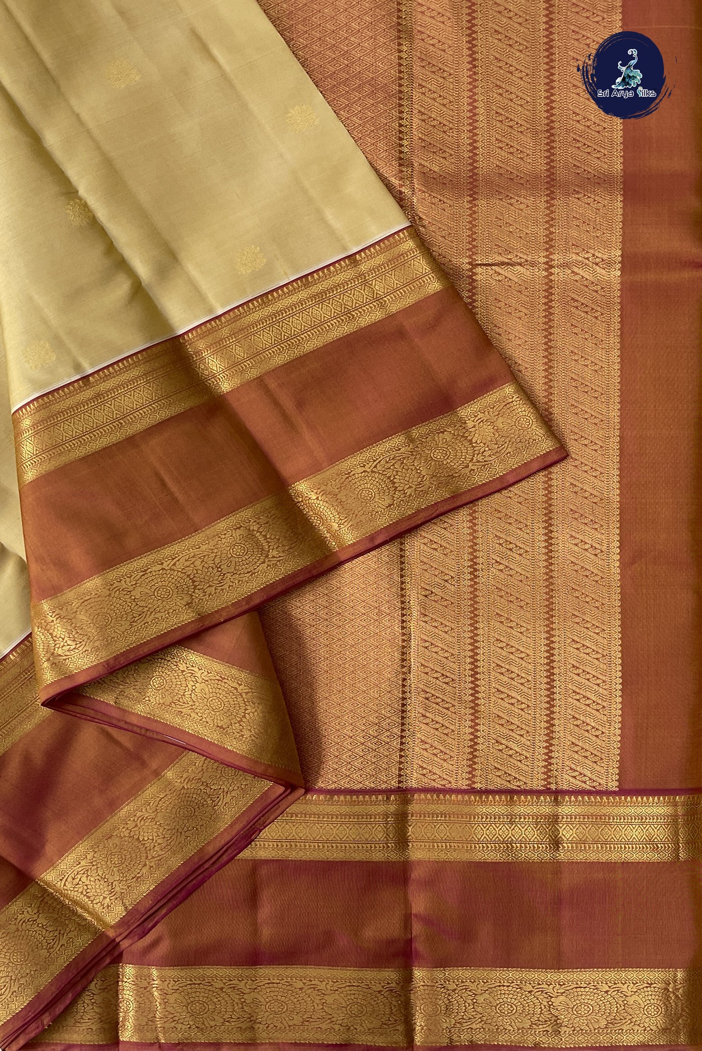 Creamish Yellow Traditional Silk Saree With Zari Buttas Pattern