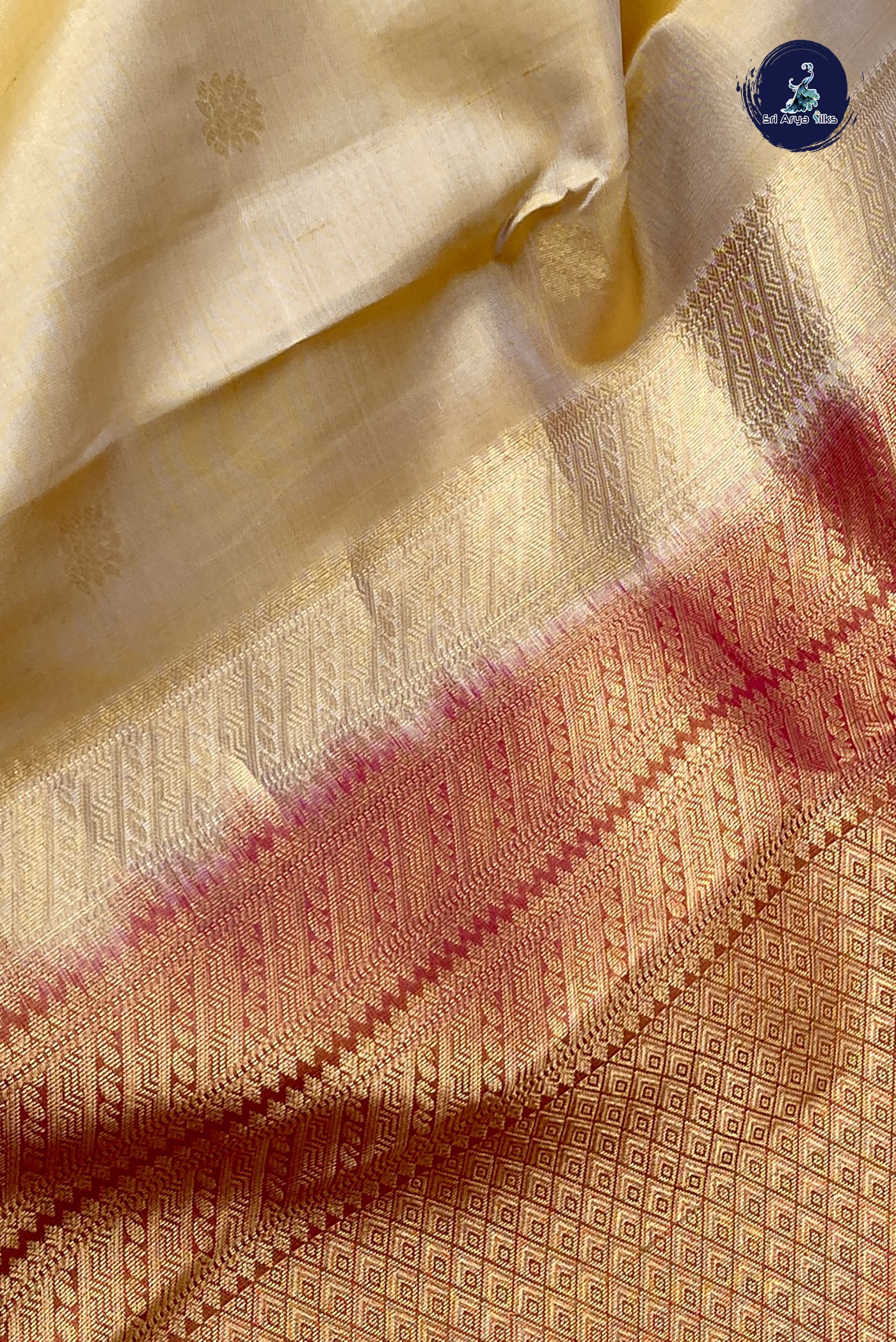 Creamish Yellow Traditional Silk Saree With Zari Buttas Pattern