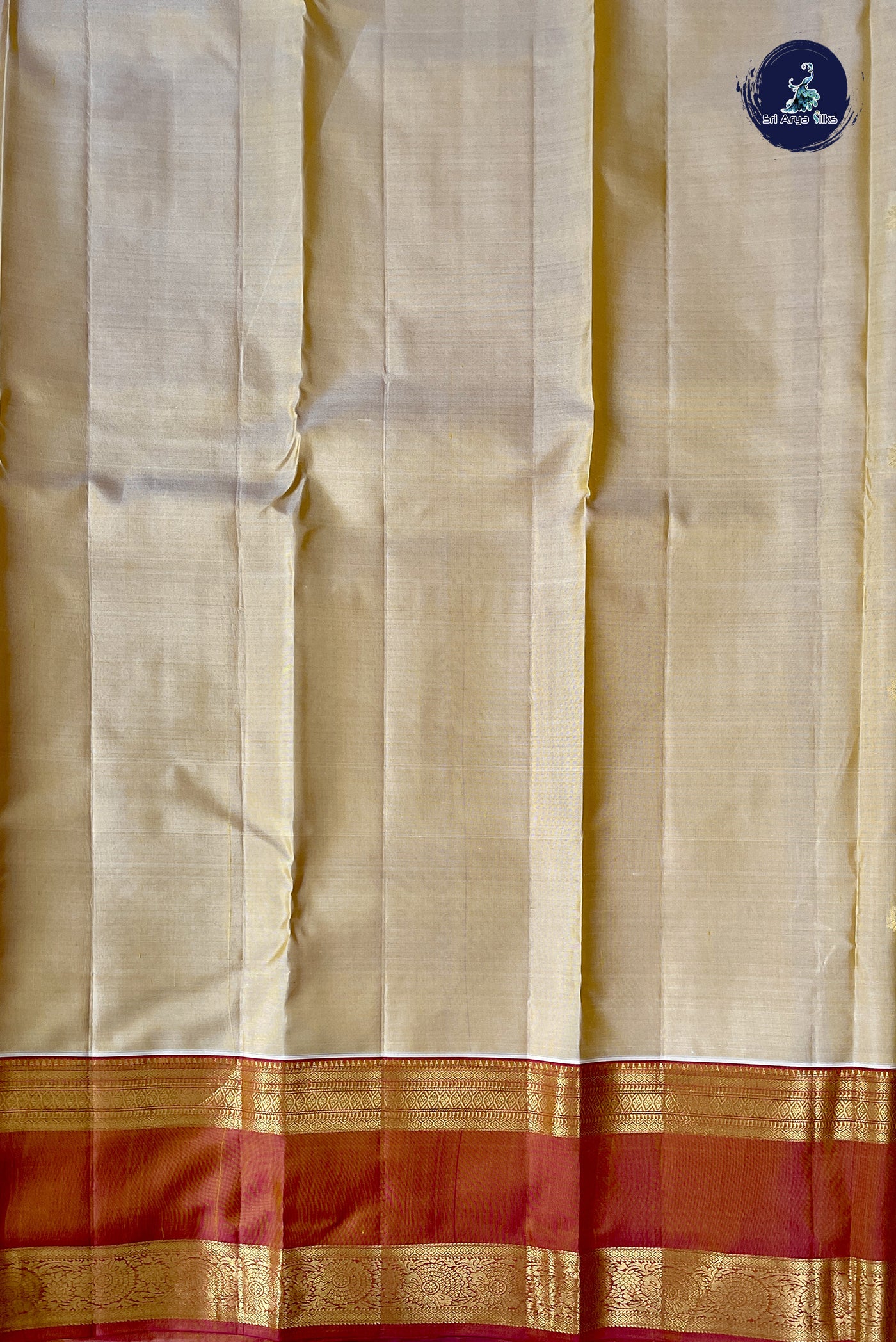 Creamish Yellow Traditional Silk Saree With Zari Buttas Pattern