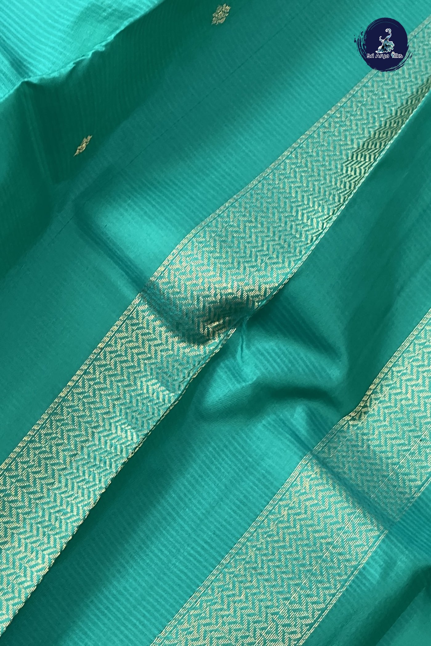 Teal Light Weight Silk Saree With Zari Buttas Pattern