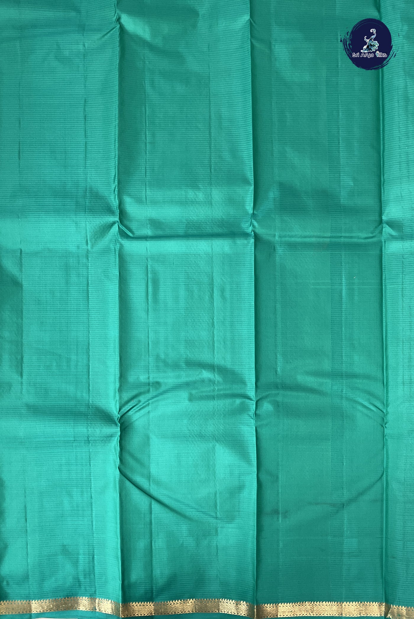 Teal Light Weight Silk Saree With Zari Buttas Pattern