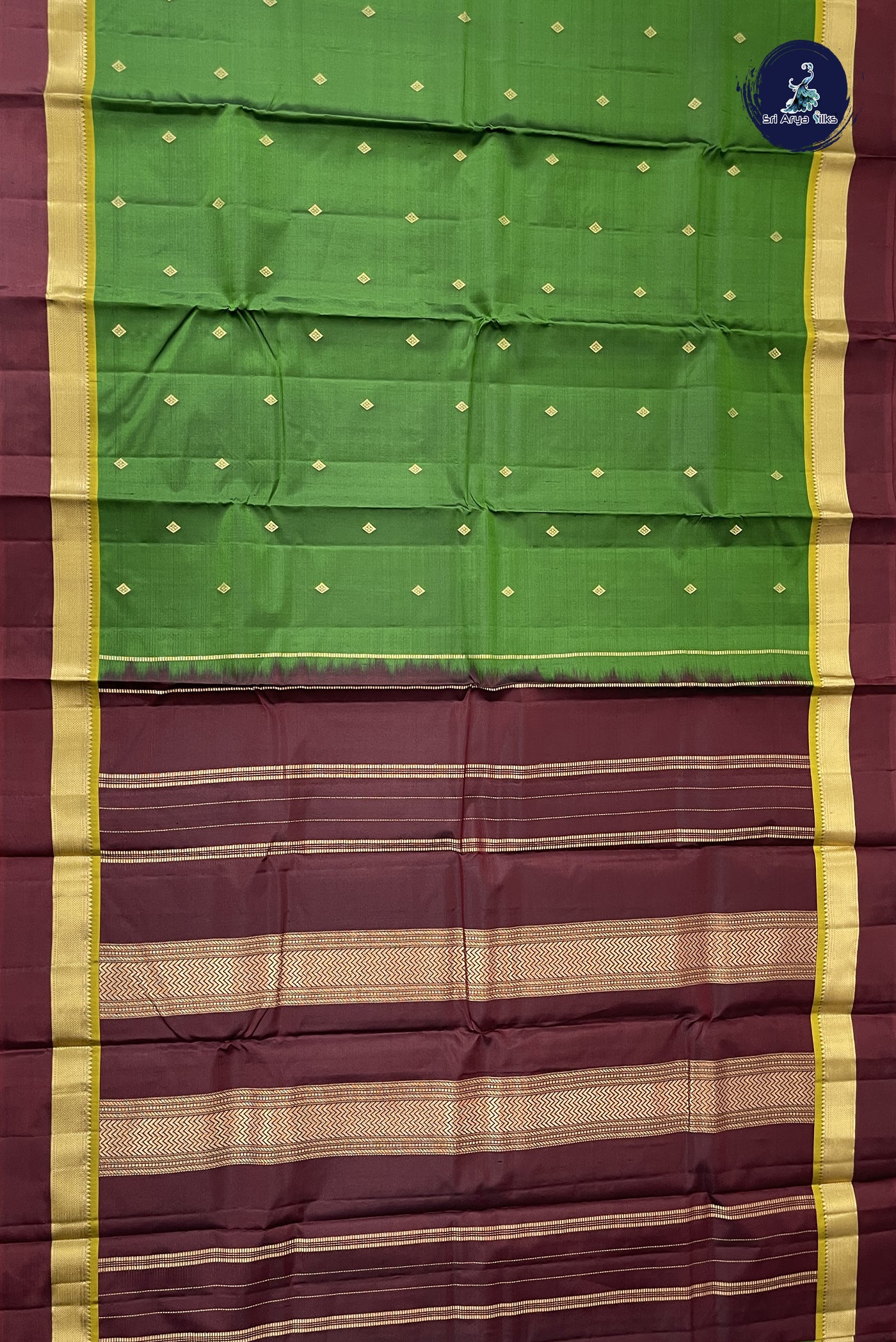 Green Light Weight Silk Saree With Zari Buttas Pattern