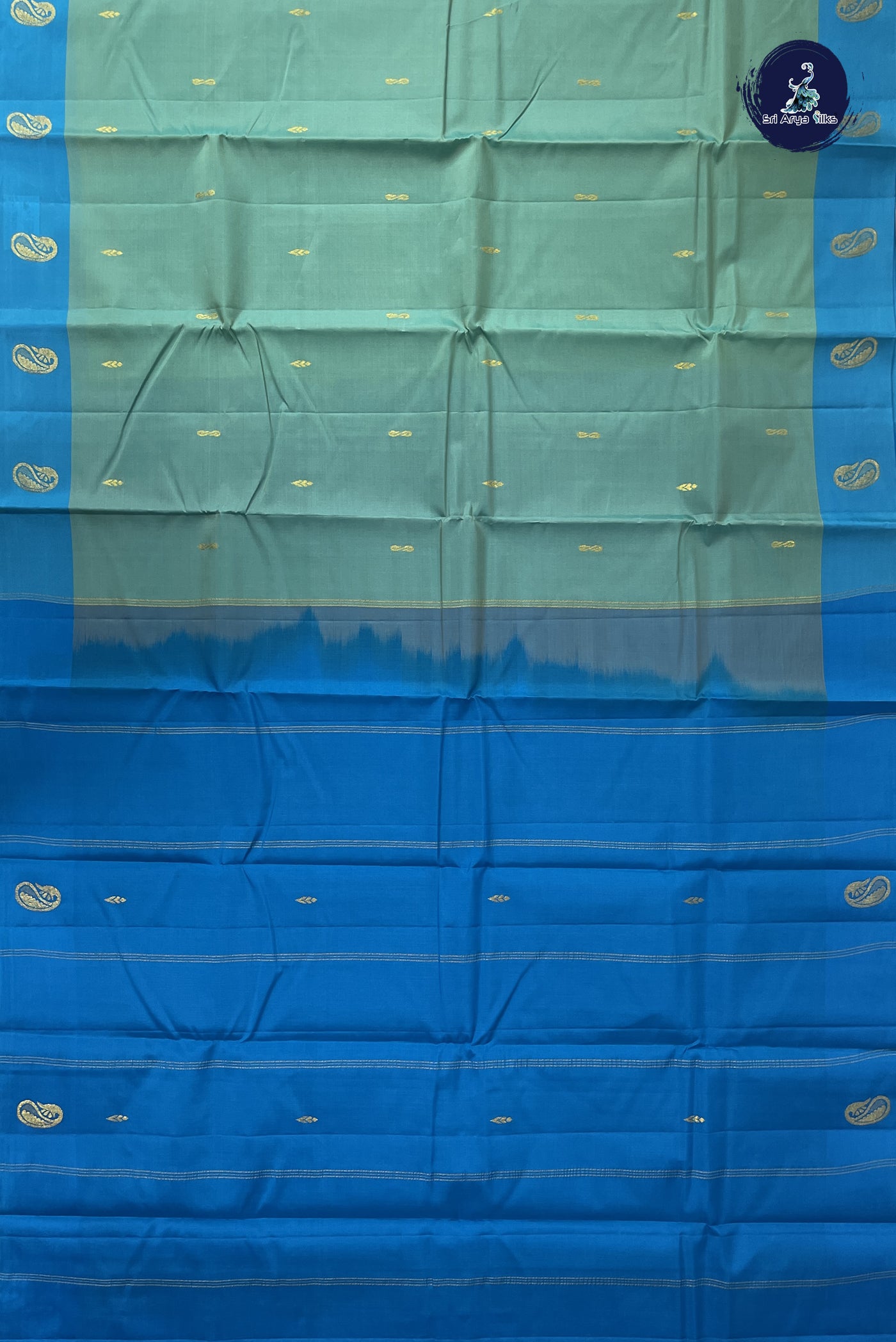 Bluish Green Light Weight Silk Saree With Zari Buttas Pattern