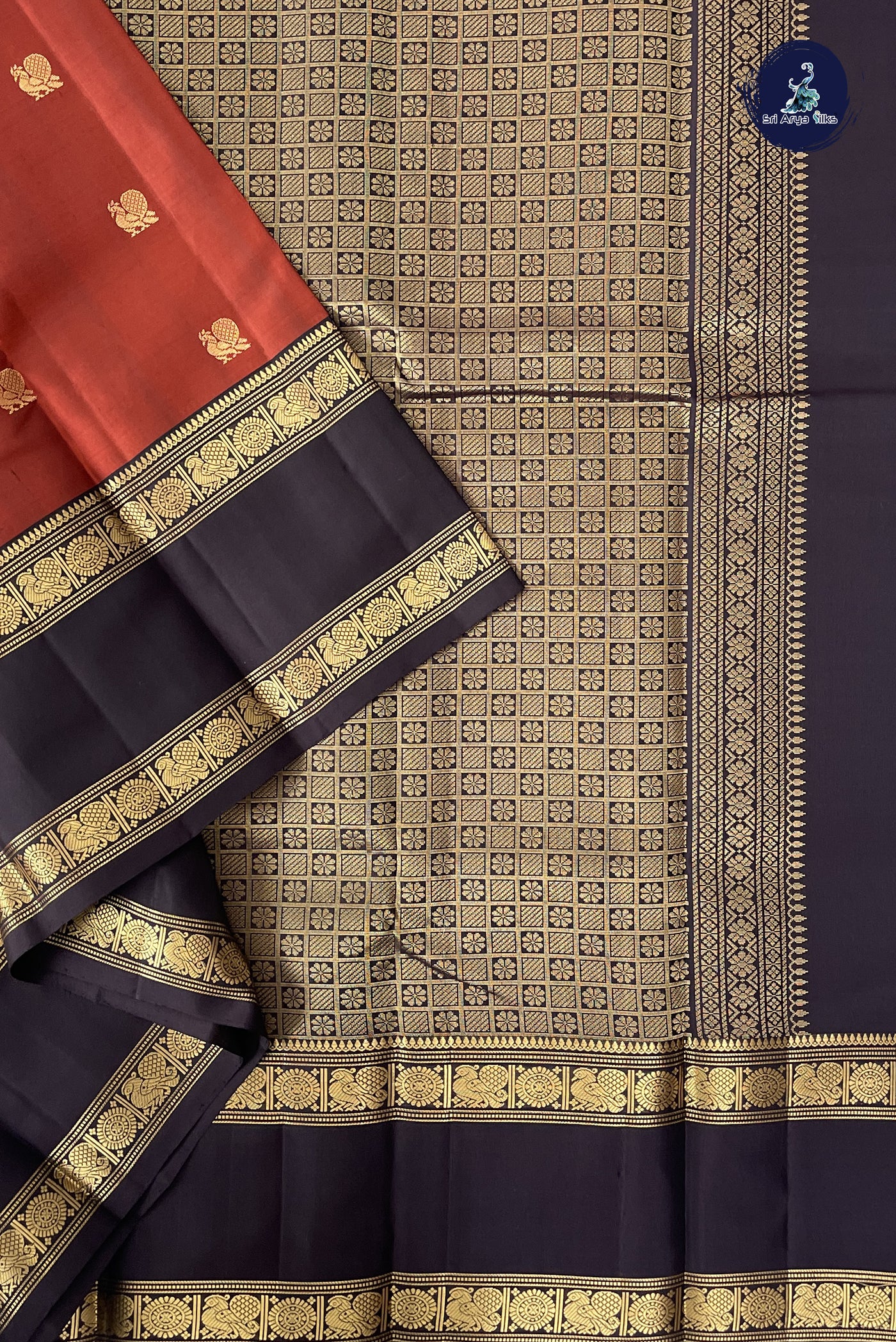Rust Traditional Silk Saree With Zari Buttas Pattern