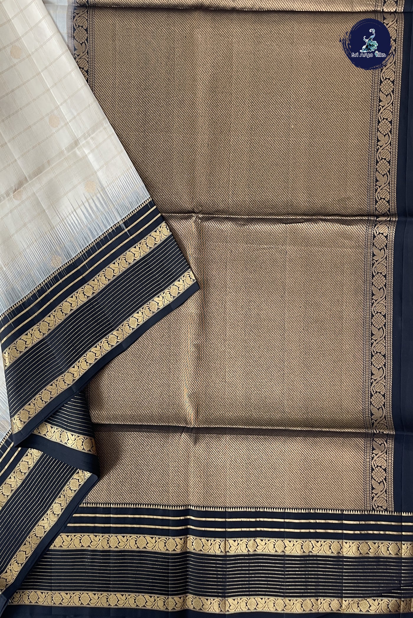 Off White Soft Silk Saree With Zari Buttas Pattern