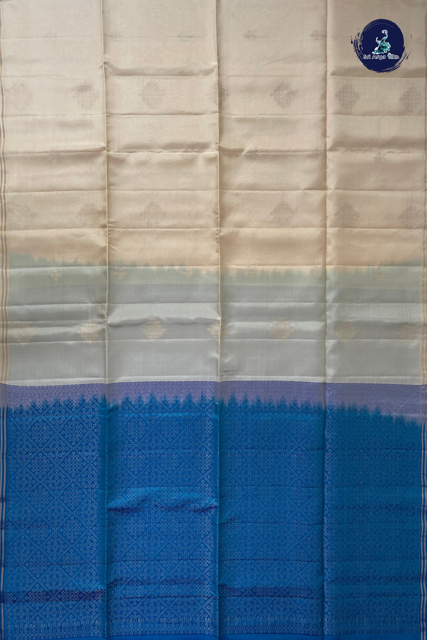 Cream Half Pure Silk Saree With Kolam Butta Pattern
