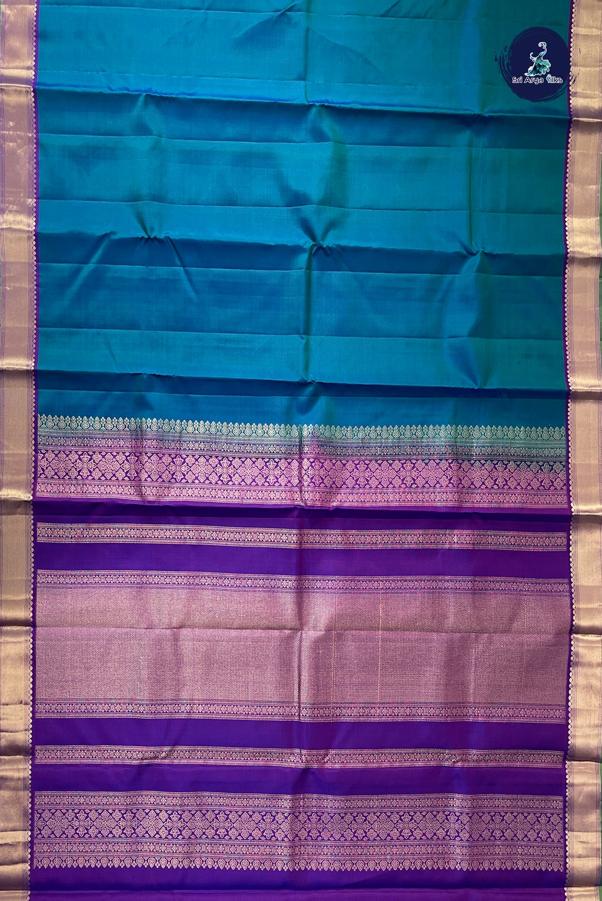 Peacock Blue Light Weight Silk Saree With Plain Pattern
