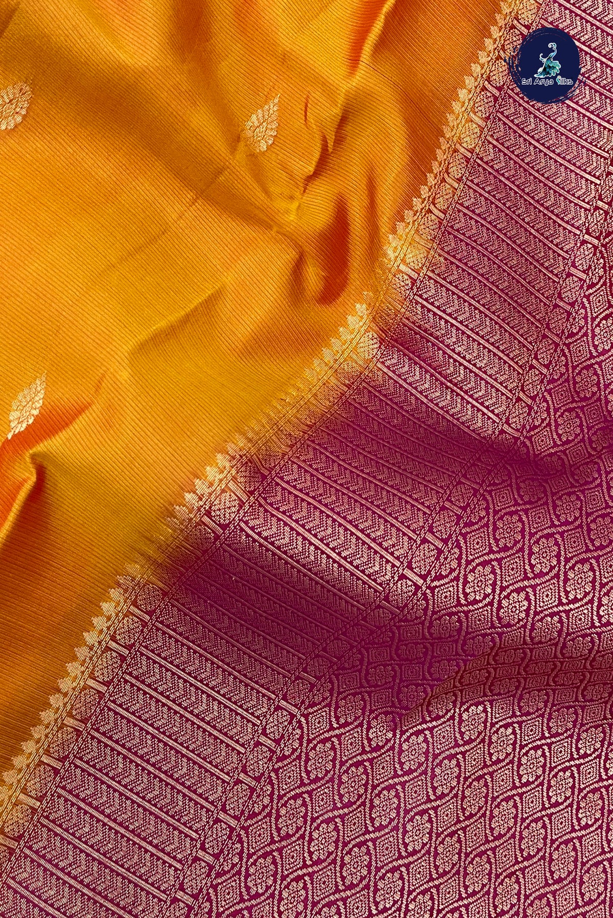 Lite Mustard Orange Rettaippade Border Silk Saree With Zari Buttas Pattern