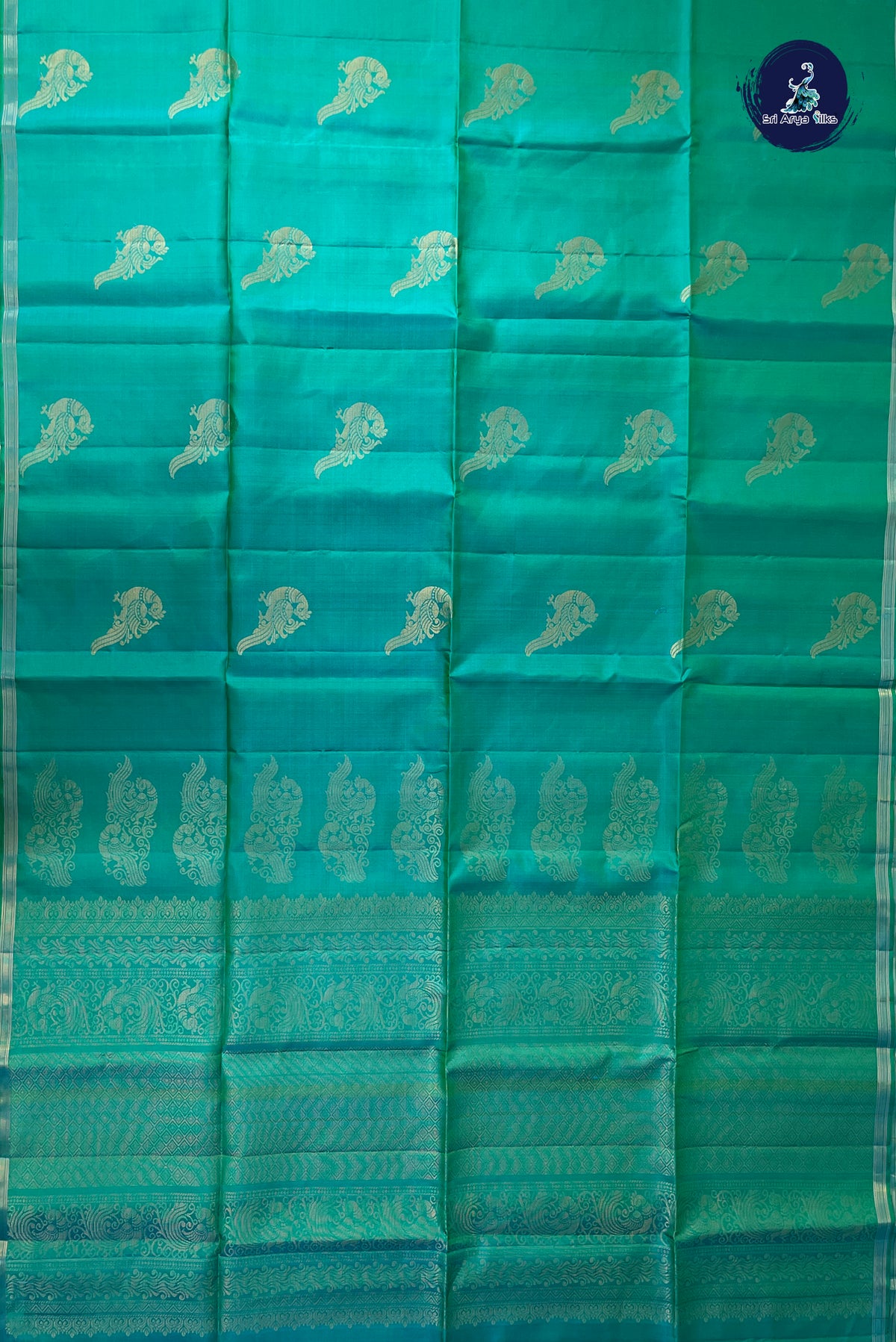 Bluish Green Soft Silk Saree With Peacock Butta Pattern