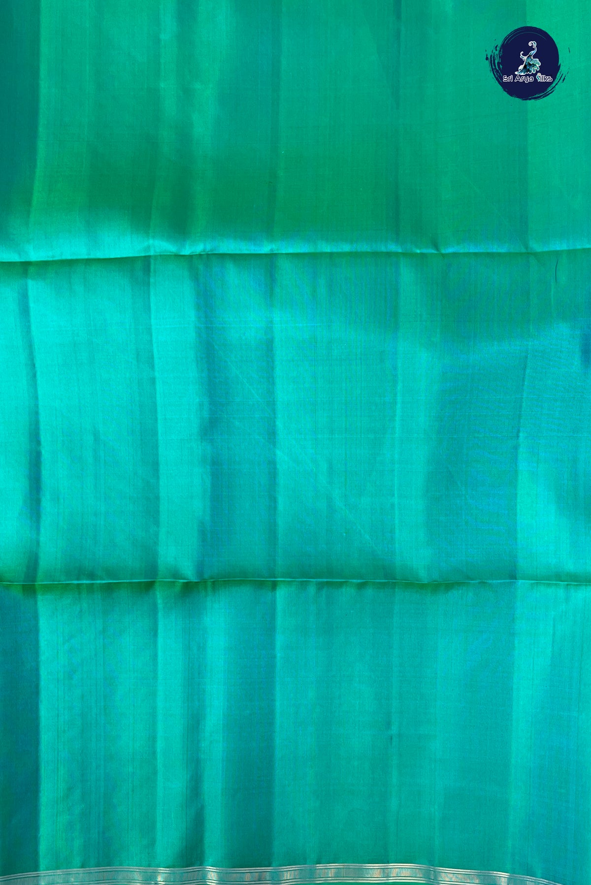 Bluish Green Soft Silk Saree With Peacock Butta Pattern