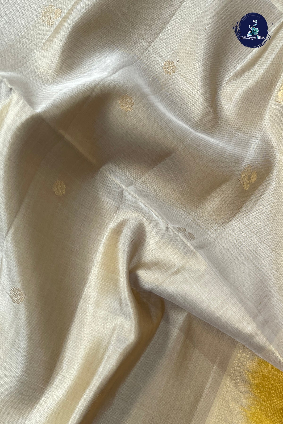 Beige Soft Silk Saree With Zari Buttas Pattern