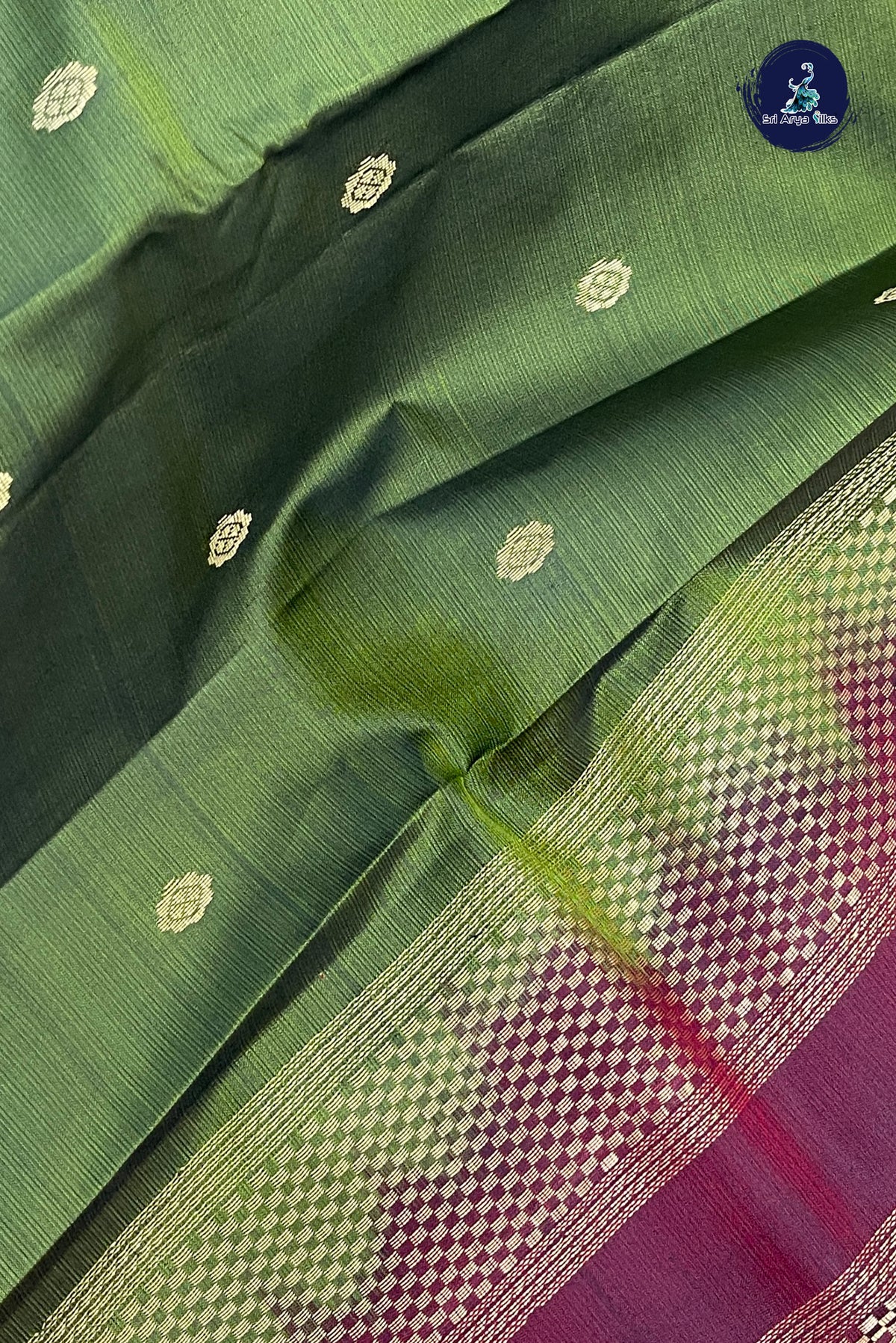 Green Light Weight Silk Saree With Zari Buttas Pattern
