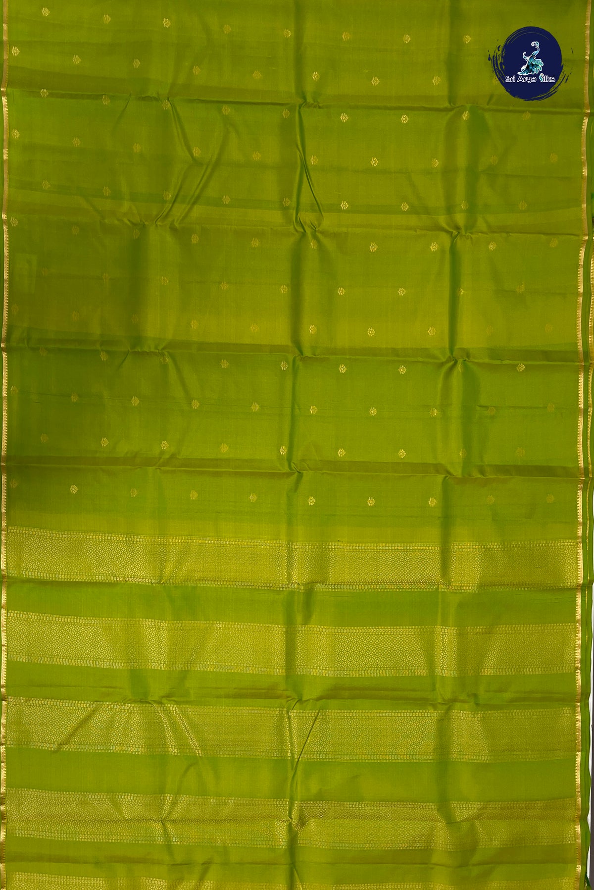 Lime Green Light Weight Silk Saree With Zari Buttas Pattern