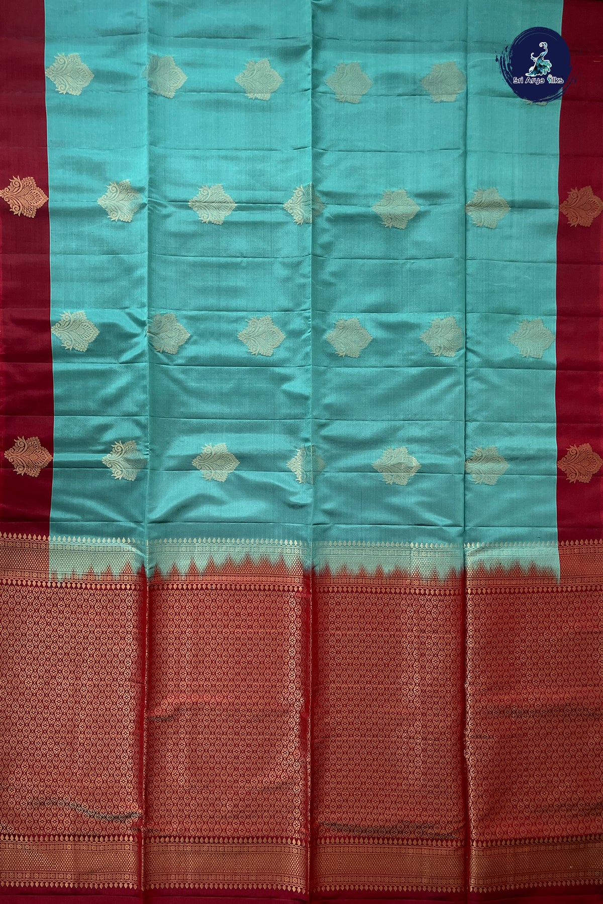 Bluish Green Half Pure Silk Saree With Zari Buttas Pattern