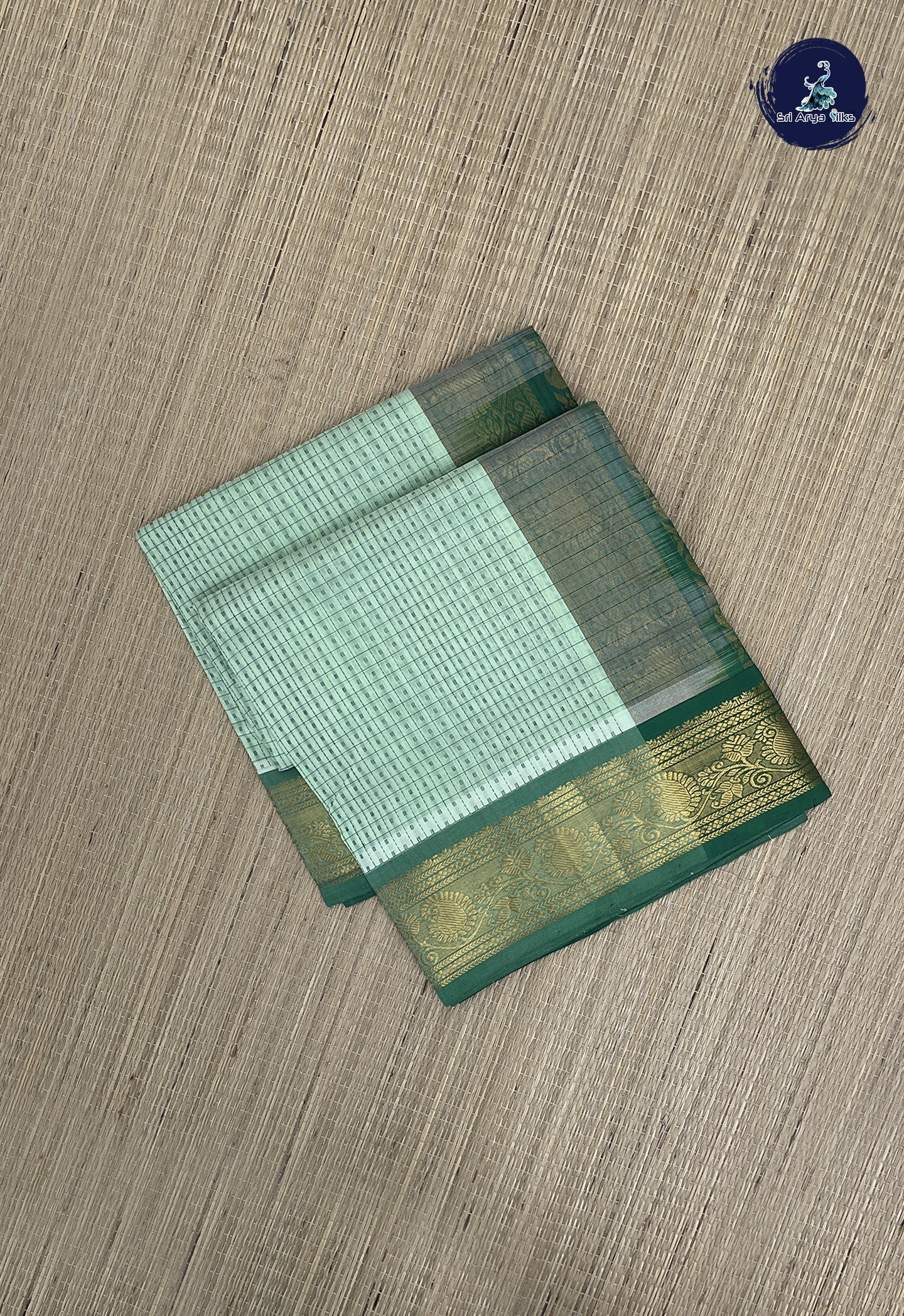Pastel Green Checked Saree With Laksha Deepam Design Pattern