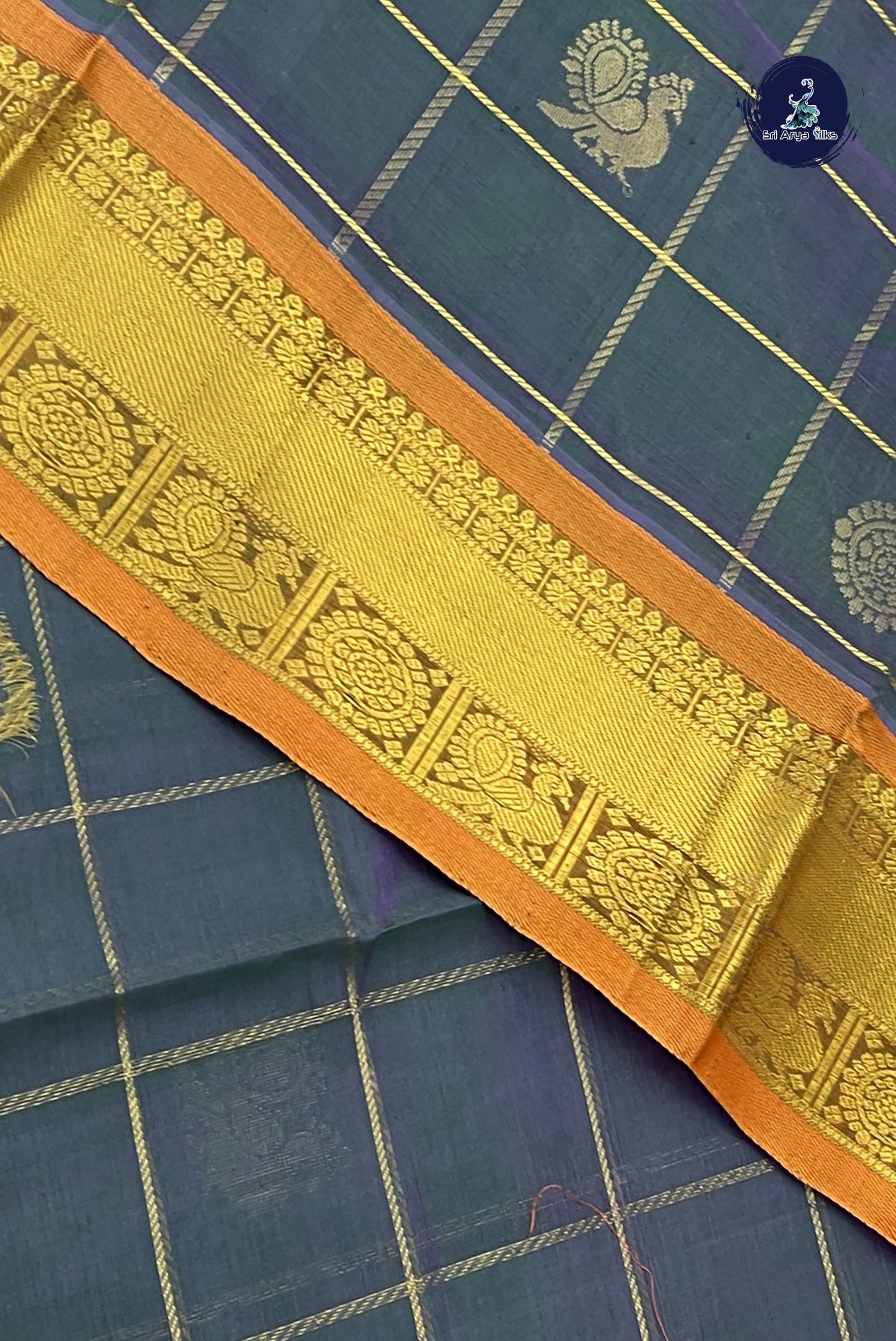 Greenish Blue Checked Saree With Mayil Chakram Butta Pattern