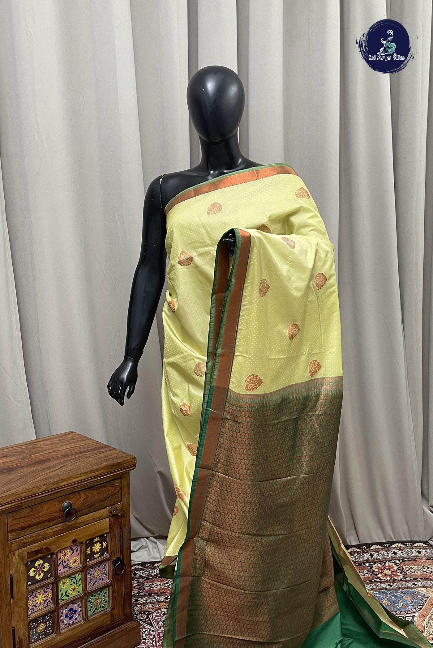 Creamish Yellow Semi Silk Saree With Copper Zari Buttas Pattern
