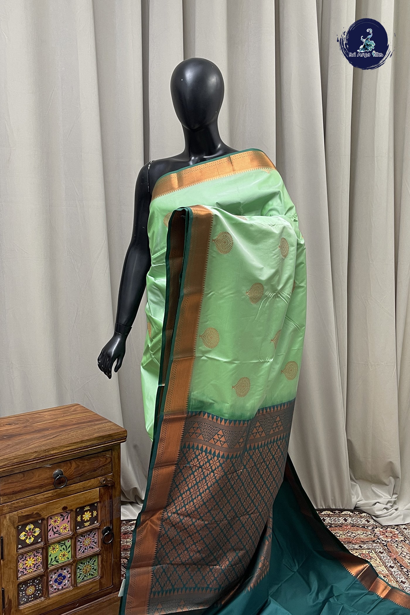 Turquoise Semi Silk Saree With Copper Zari Buttas Pattern