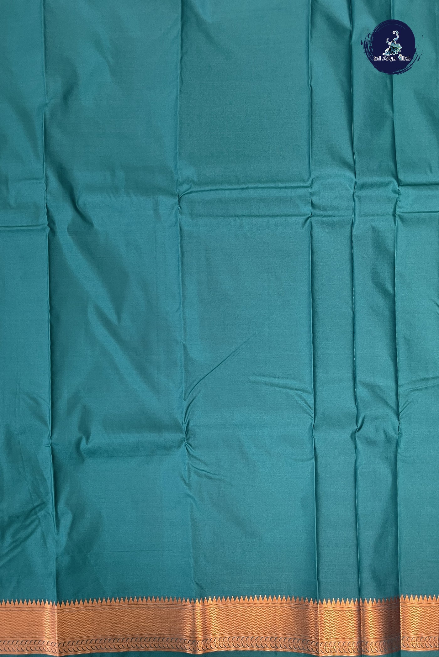 Turquoise Semi Silk Saree With Copper Zari Buttas Pattern