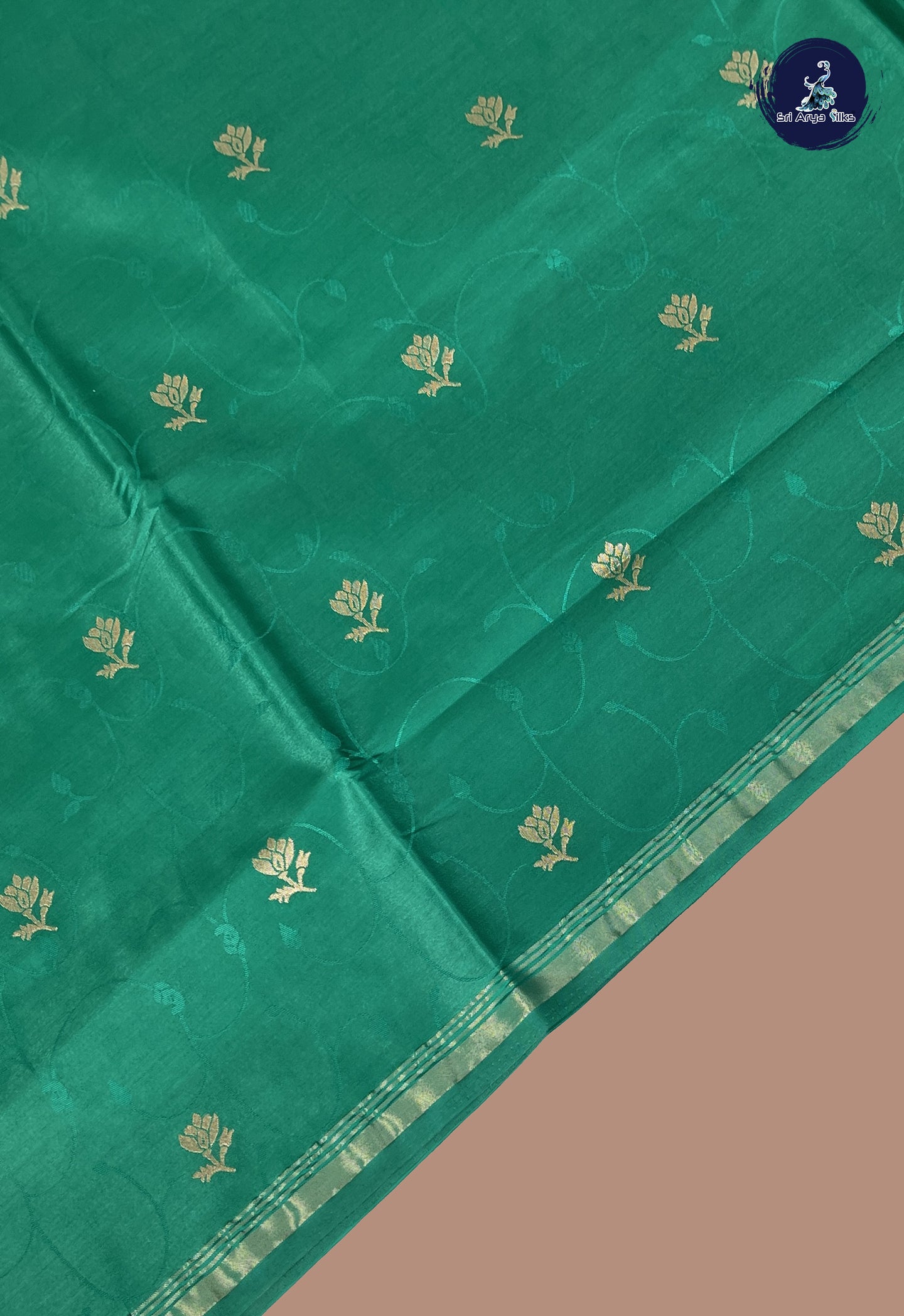 Sapphire Green Semi Soft Silk Saree With Embossed Pattern