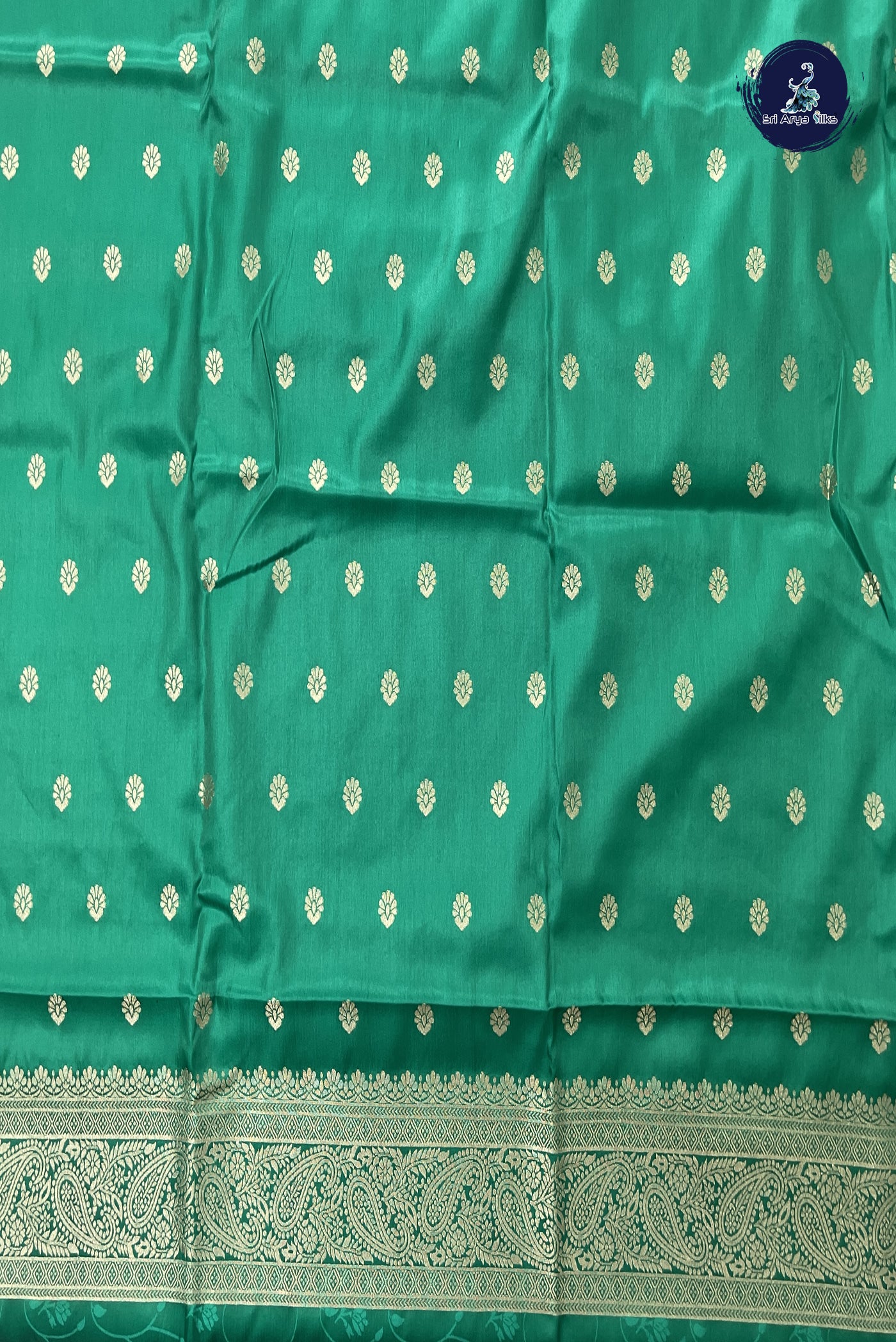 Green Semi Silk Saree With Embossed Pattern