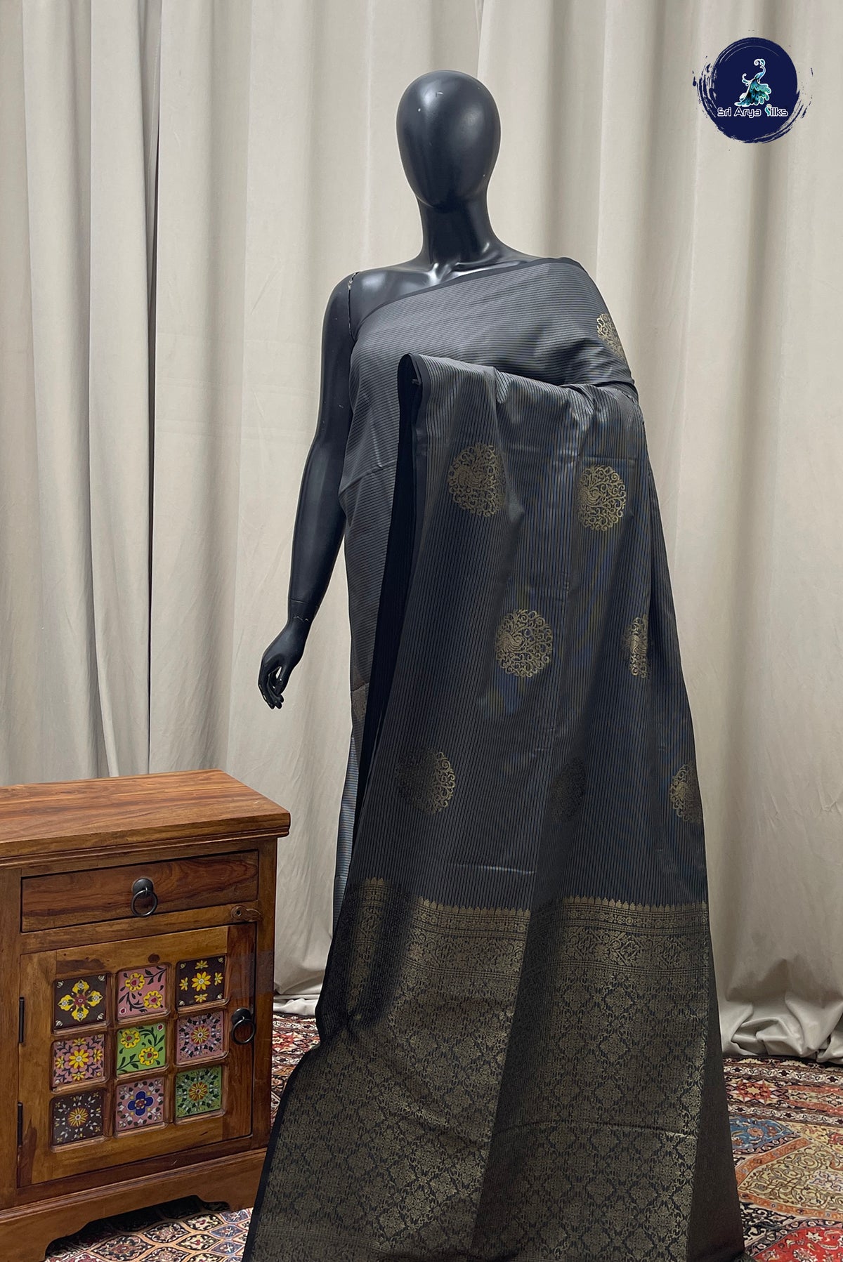 Black Semi Soft Silk Saree With Zari Buttas Pattern