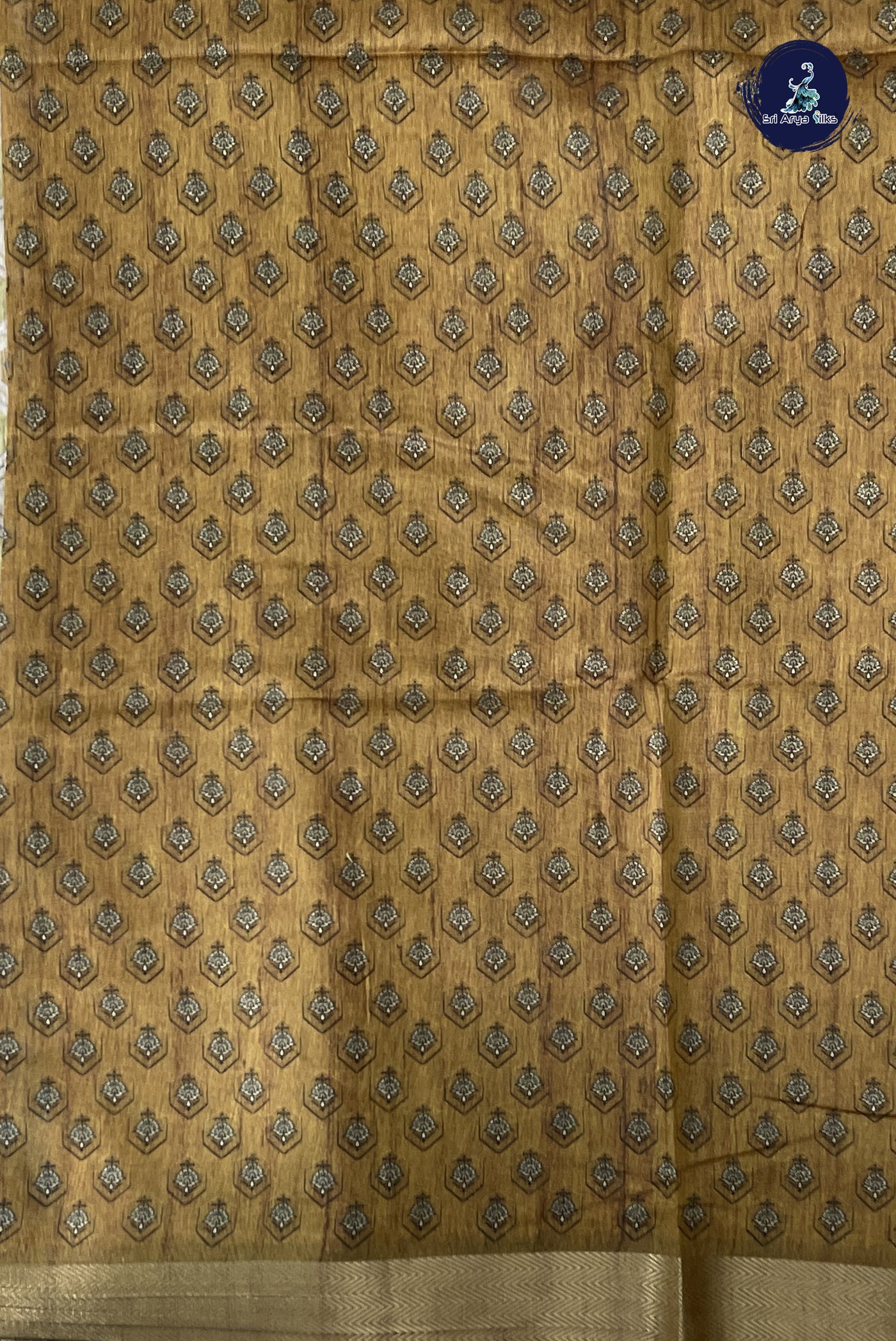 Chikku Shade Semi Chanderi Saree With Printed Pattern