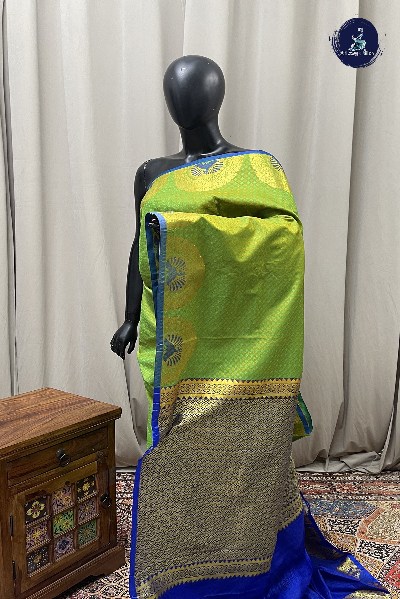 Green Semi silk saree with embossed pattern