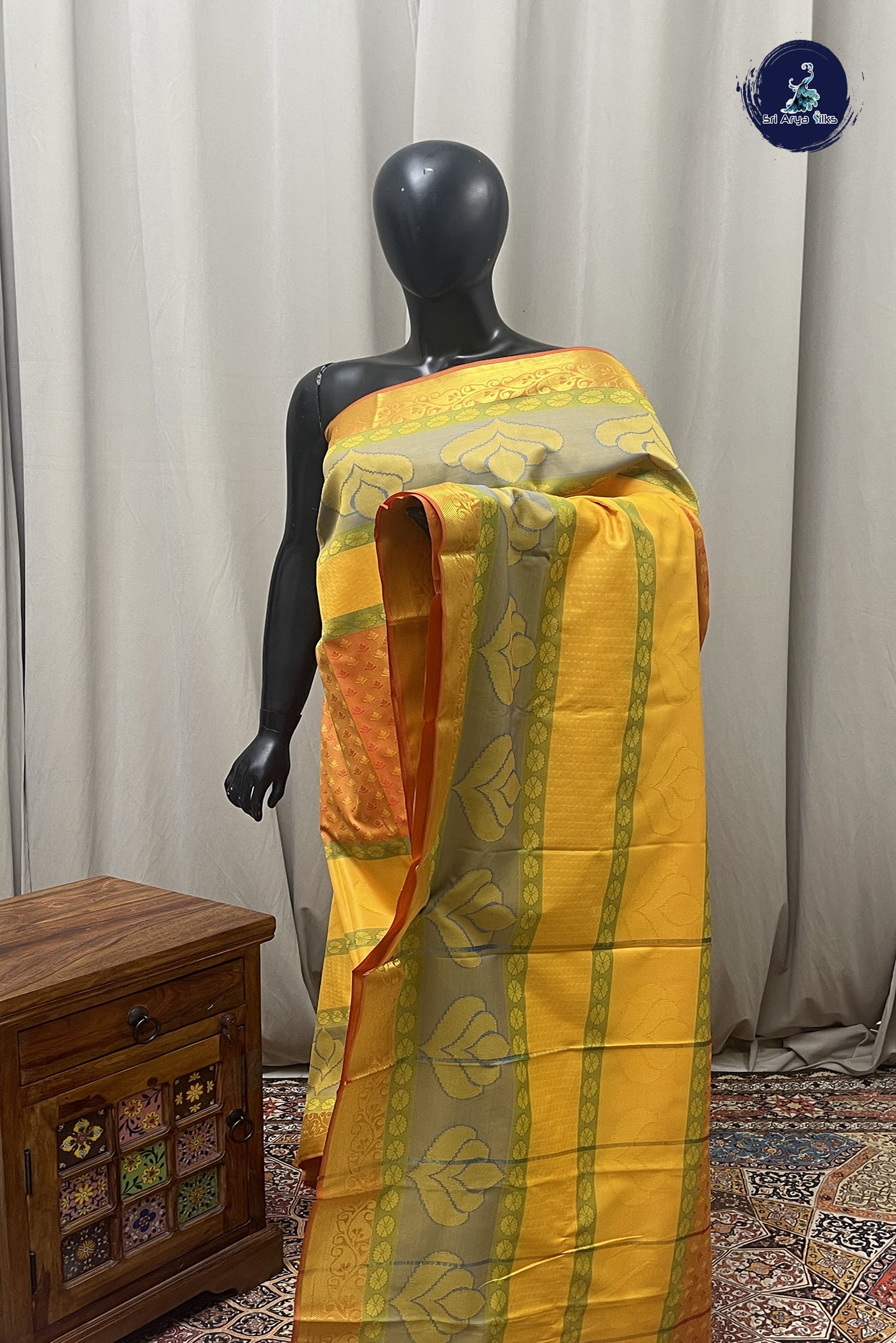 Yellow Semi Silk Saree with Embossed Pattern