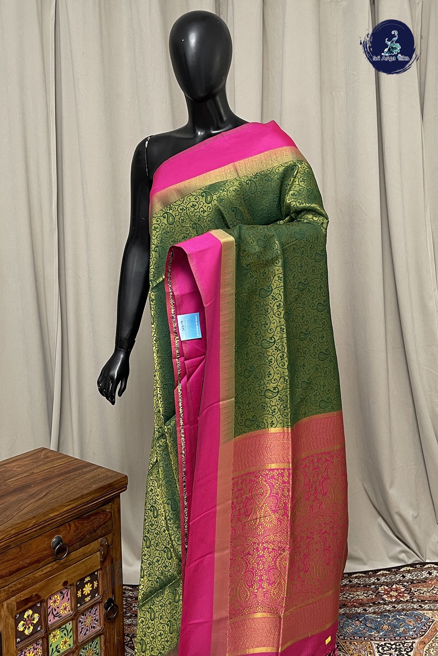 Dark Green Semi Silk Saree With Embossed Pattern