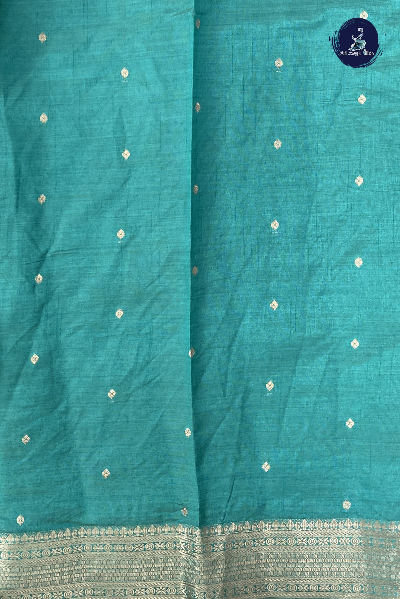 Teal Semi Tussar Saree With Zari Buttas Pattern