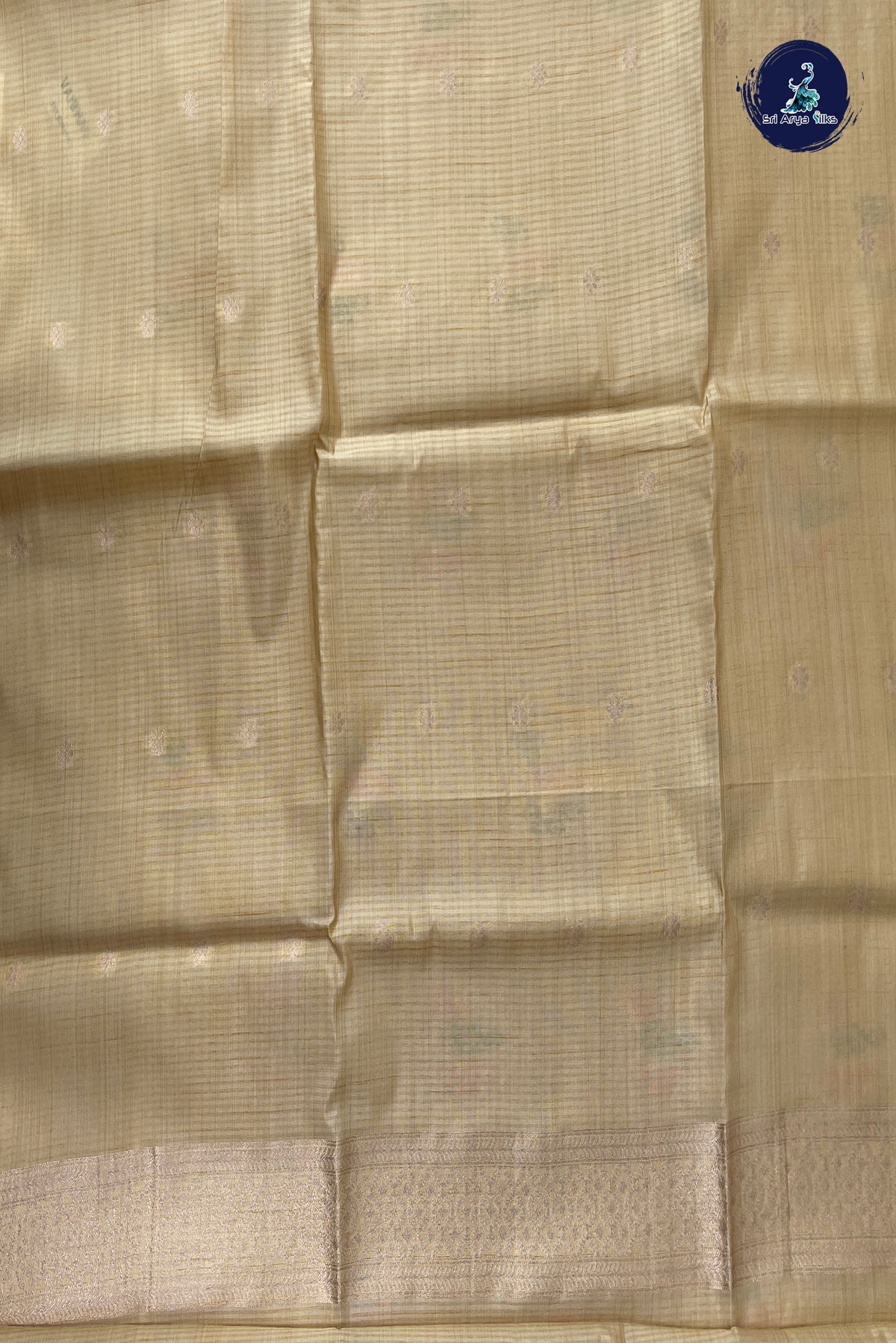 Cream Semi Tussar Saree With Zari Buttas Pattern
