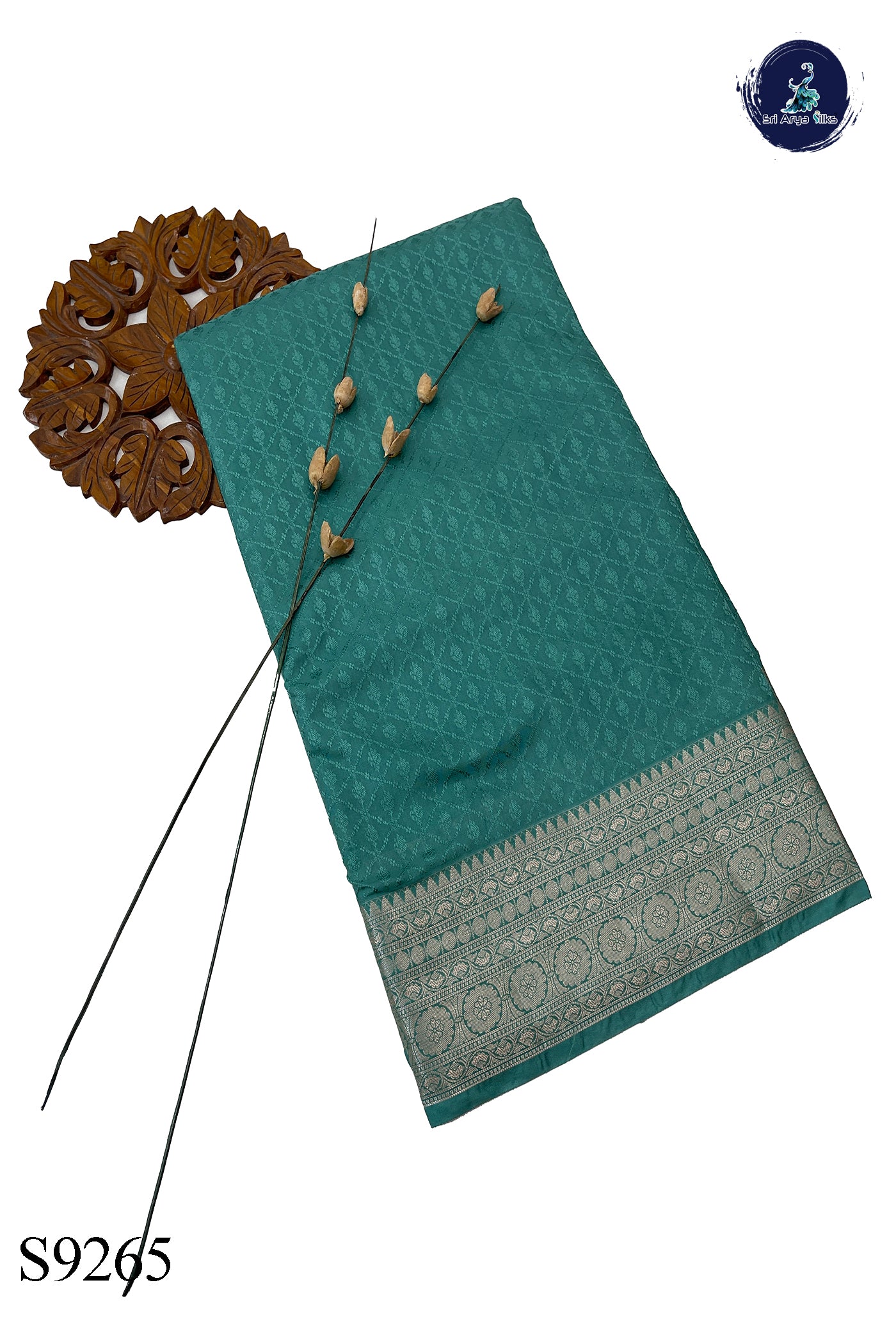 Teal Semi Raw Silk Saree With Embossed Pattern