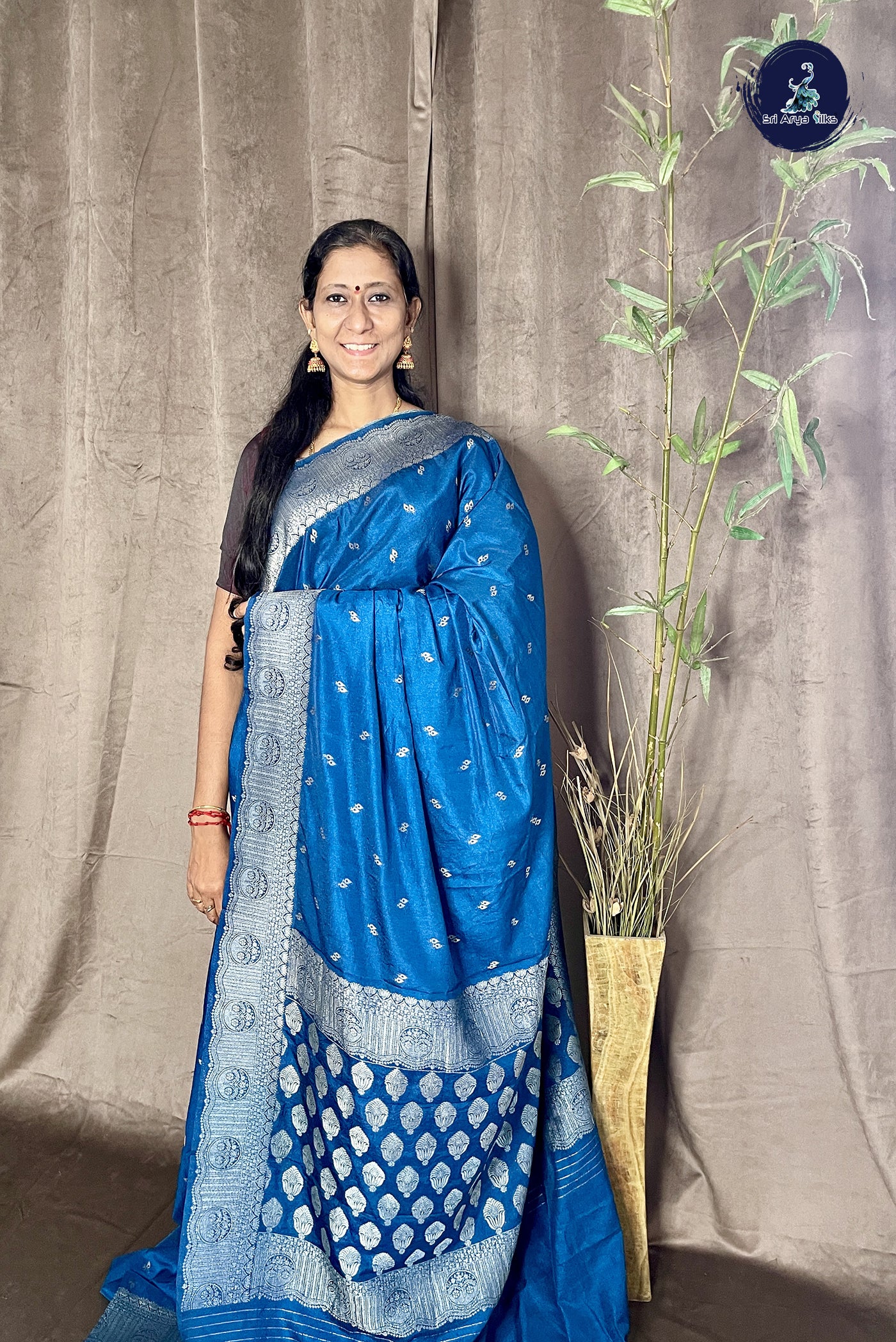 Sapphire Blue Georgette Banarasi Saree With Zari Buttas Pattern