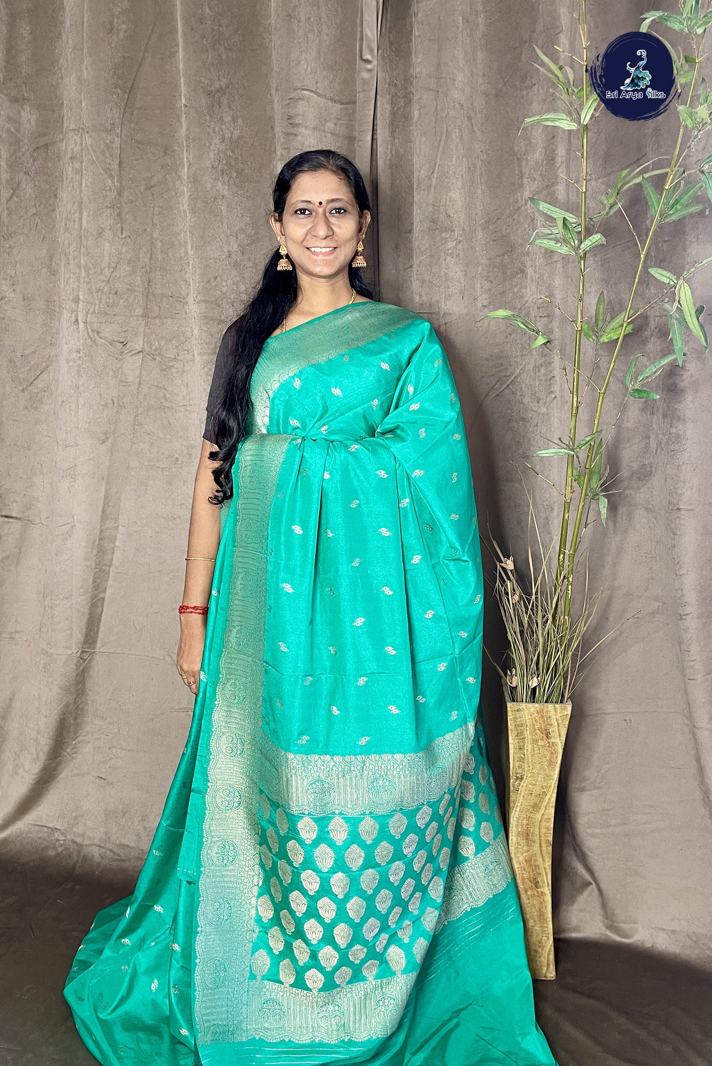 Green Georgette Banarasi Saree With Zari Buttas Pattern