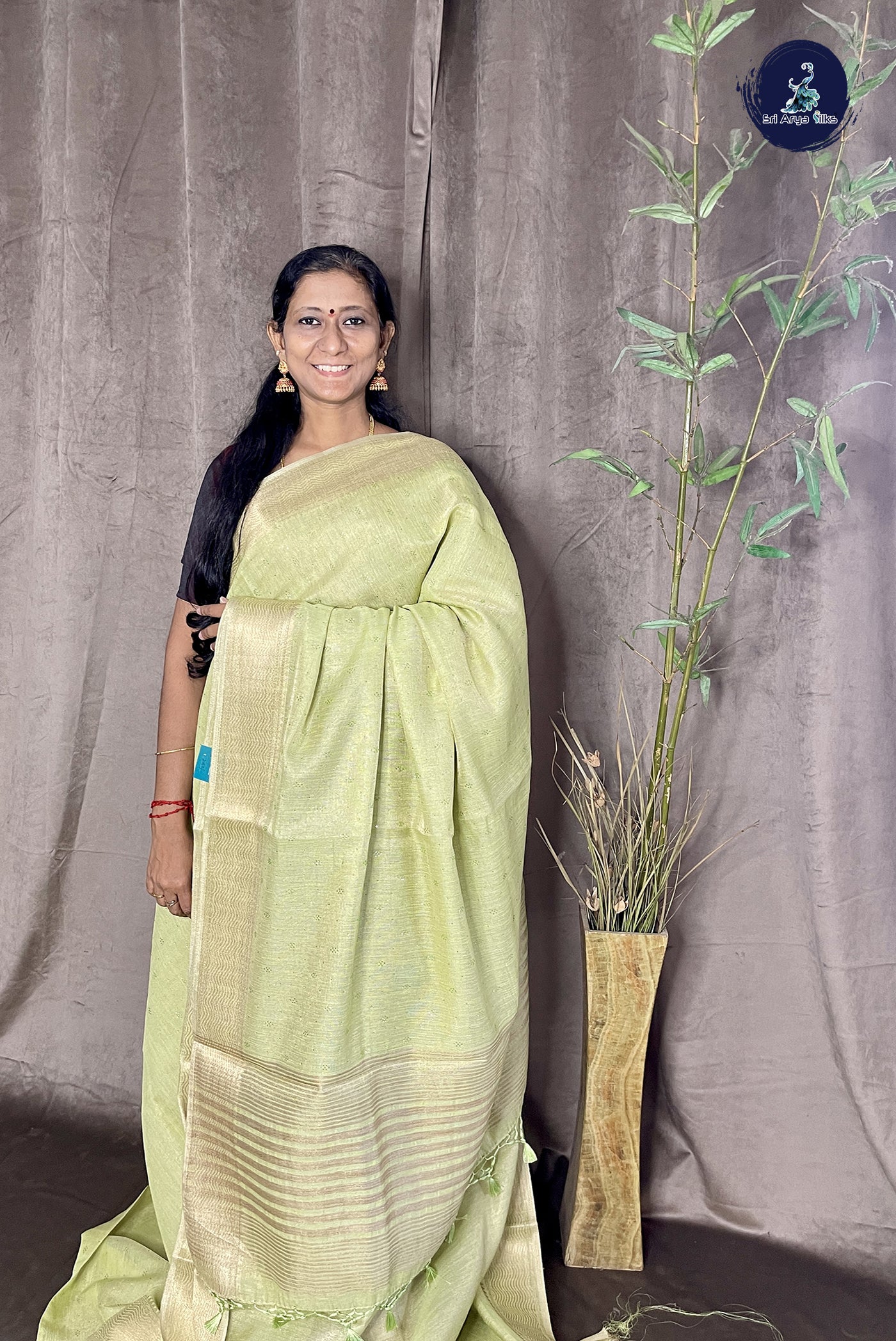Pista Green Linen Saree With Stone Work Pattern