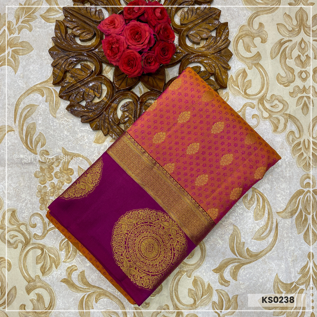 Dual Tone Orange Brocade Silk Saree With Magenta Pink Blouse & Embossed Pattern